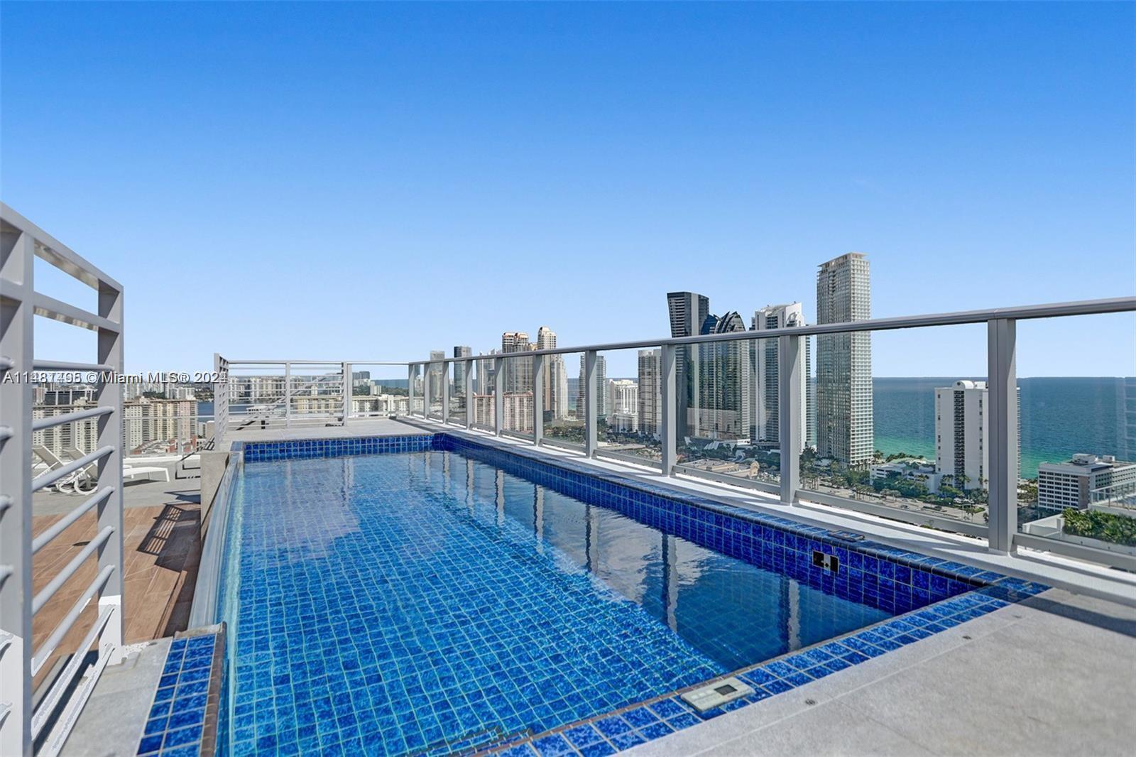 Welcome to the epitome of luxury living in Sunny Isles Beach! This magnificent condo boasts unparalleled elegance and sophistication, complemented by its exceptional private rooftop and private pool. You will be immediately captivated by the grandeur displayed throughout this home. Expansive floor-to-ceiling windows offer breathtaking views of the glistening ocean, intracoastal and city skyline.The state-of-the-art kitchen is a true chef's dream, with top of the line appliances, custom cabinetry, and large island.  Parque Towers grants you access to upscale amenities including heated pool, jacuzzi, sauna, gym, kid's play room, club room, theater, game room, guest suites, lounge & dog park. This unit includes two garage spaces, two valet and & storage unit. Being sold under appraised value.