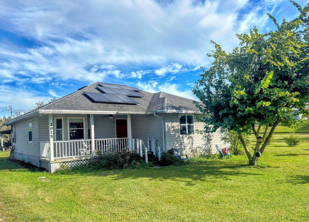 Centrally located just 1.5 hours from Miami/Fort Lauderdale or Fort Myers, this charming home delivers the best of the Florida waterfront lifestyle. Positioned directly across from the Ortona boat ramp, you’ll enjoy effortless access to the Caloosahatchee River—part of the Intracoastal Waterway with deep water access to the Gulf, Atlantic, and Lake Okeechobee. Simply walk across the street to fish, launch your boat, or relax while taking in peaceful river views. Inside, the home features a spacious open-concept great room and an updated kitchen with a gas range, newer cabinetry, pantry, and appliances—all less than four years old. An oversized laundry room includes a newer washer and dryer for added convenience. The 15' x 15' primary suite offers a private retreat with a large walk-in closet and an updated shower. Energy-efficient solar panels help keep electric costs low. Outdoors, the fully fenced property is packed with extras, including a 36' x 24' pole barn with electric service and a versatile 34' x 11' he/she shed equipped with electric, water, and A/C—perfect for a workshop, hobbies, or a personal retreat. Plus: This property is available turnkey—just bring your toothbrush and start enjoying the river lifestyle!