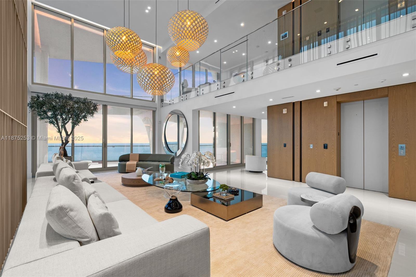 Welcome to Sky Villa 5105 at Jade Signature, a rare two-story residence in the sky curated entirely by Artefacto. Spanning over 6,500 SF, this 5-bedroom, 6.5-bath home offers soaring double-height ceilings, walls of glass, and seamless indoor-outdoor living with expansive terraces + service quarters. Every space is masterfully designed with bespoke finishes, custom millwork, and a private elevator. The oceanfront primary suite offers a spa-inspired bath and oversized dressing room, while a private elevator ensures effortless access. Residents enjoy resort-style amenities including beachfront service, world-class spa, fitness center, kids’ club, wine bar, valet, and full concierge. An unmatched lifestyle of elegance and ease awaits.