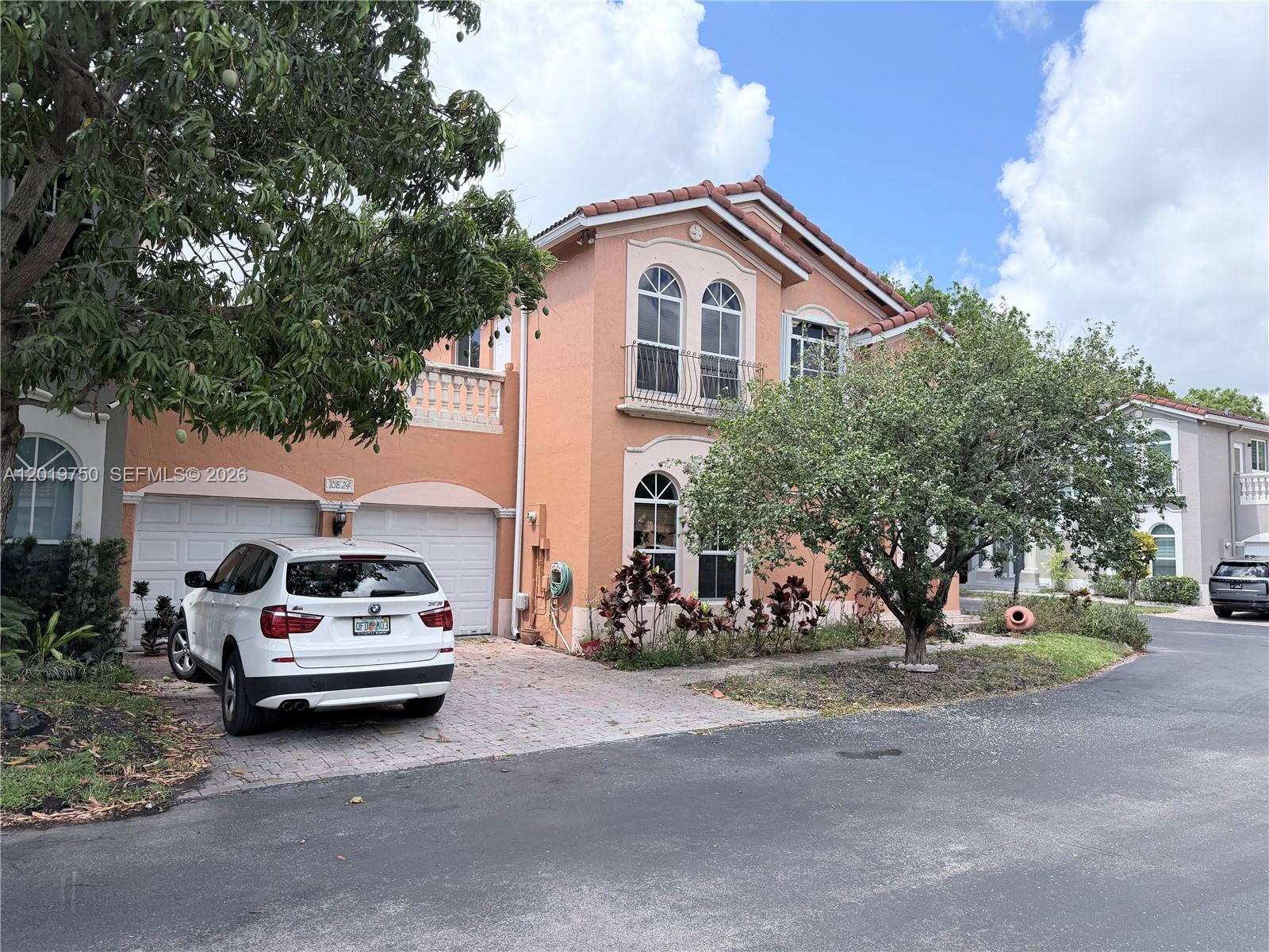 Great Location, Spectacular Mediterranean style. 4BR 3.5 Bath home, formal living and dining room, huge family room, LOFT, roof top terrace/sun deck overlooking the spacious patio and your own in-ground POOL. Eat-in kitchen with wood cabinets, granite countertops, new washer/dryer & A/C, full bedroom and bath downstairs, tile 2nd floor. Hurricane shutters. Large two car garage, Outside shower/cabana bath, low HOA includes gated security, alarm, cable, walking distance to schools, shopping, entertainment, basic cable TV and ADT monitoring included.
