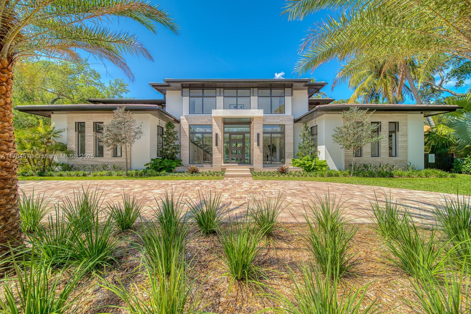Stunning new home located on beautiful Granada Blvd.. Its grand entrance with spectacular swivel front door, exterior and interior water features and a 25 ft travertine wall sets the tone for the sophistication within. This breathtaking home offers a keystone fireplace, stone floors, elevator & mud room.  Its jaw dropping kitchen is a culinary dream, with a butler's pantry & separate wine closet.  Living areas overlook the outdoor oasis with pool & summer kitchen, perfect for alfresco dinning and entertaining. The family/man cave room includes a dazzling bar that is a work of art. Gorgeous primary suite and with covered terrace and spectacular bath with steam shower, free standing tub, and outside shower that transcends you to a 5 star hotel. Come see this masterpiece and make it yours.