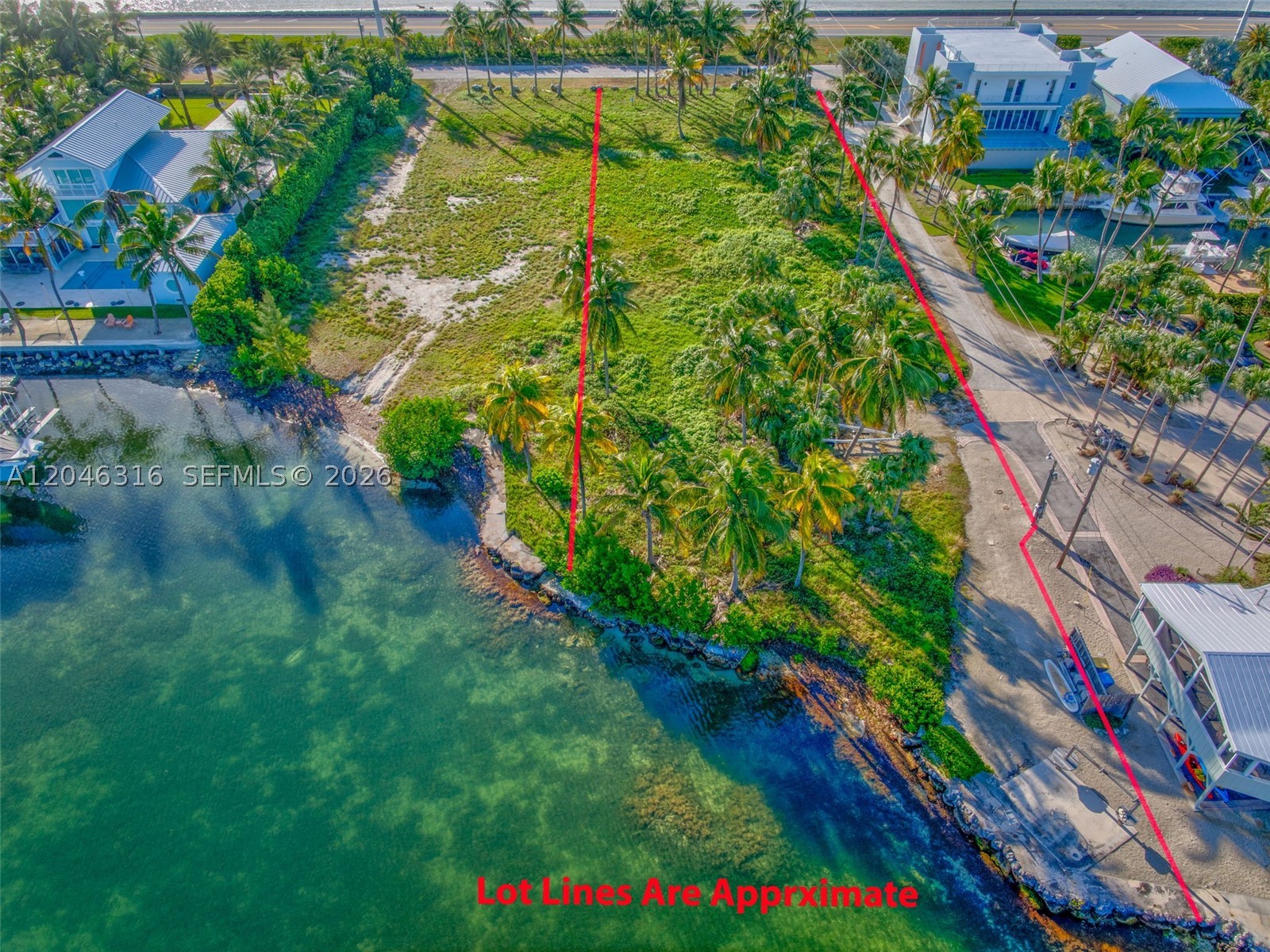 A truly once in a generation opportunity to build your dream estate in the heart of Islamorada's coveted Lower Matecumbe. This exceptional vacant homesite is one of the few remaining parcels of its size available in all of Islamorada, offering an incredibly rare combination of breathtaking ocean views and expansive wide canal views. Encompassing over 32,000 square feet, this extraordinary property provides the perfect canvas for a custom waterfront residence designed to capture spectacular sunrises, refreshing ocean breezes, and the unmatched beauty of the Florida Keys. Its unique setting offers the best of both worlds--open water vistas in the front and a wide canal in the rear, creating an unparalleled lifestyle for boating enthusiasts and those seeking privacy, space, and unforgettable scenery. Opportunities to acquire a property of this caliber have become increasingly scarce in Islamorada, where large vacant parcels are exceptionally limited. Whether you're envisioning a private family compound or a legacy waterfront estate, this one-of-a-kind offering represents a chance to create something truly extraordinary in one of the Florida Keys' most desirable destinations.