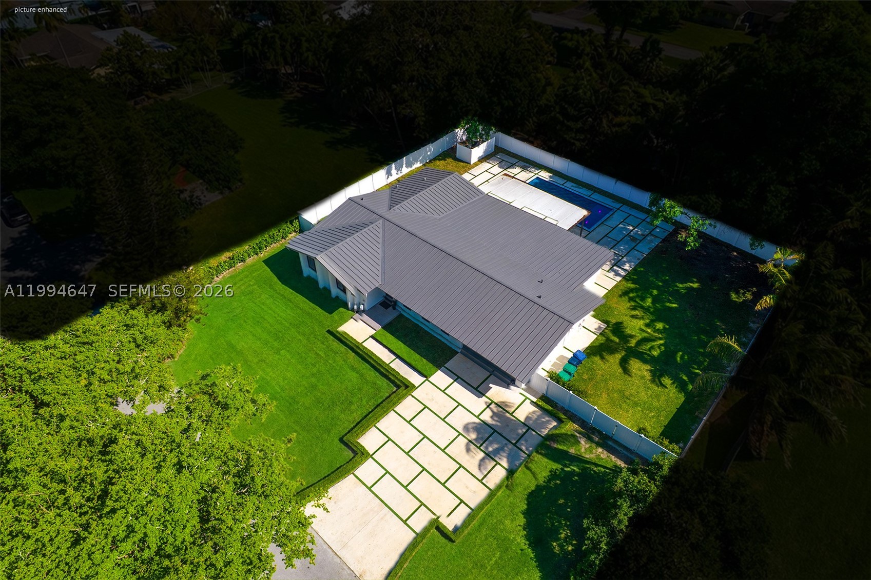 This is the one. Fully rebuilt 5BD/3BA on a rare estate-sized lot in Palmetto Bay. 2,696 SF, NO HOA, heated saltwater pool, and room for a pickleball court. New everything: electrical, plumbing, metal roof, 2 A/C units, water heater, concrete. All permitted. Zero deferred maintenance.
The kitchen will sell this home. A one-of-a-kind oversized island with built-in storage, integrated wine cooler & massive quartz countertop. Full suite of LG Smart appliances, modern cabinetry & open-concept flow into living and dining. You have to see this island in person.
Electric blinds on every window. Complete impact windows & doors. Porcelain tile throughout. Split-bedroom floorplan with two master suites, each with renovated en-suite baths & walk-in showers. New drywall, doors & designer light fixtures. Nothing left untouched.
The backyard is your private retreat: saltwater pool with heater, grass-paver accents & mature tropical landscaping. Oversized A/C 2-car garage with Tesla EV charger. Extended driveway for guests.
Minutes from Westminster Christian & Palmer Trinity. Near Old Cutler Rd & Deering Estate. Schedule your private showing before someone else does.