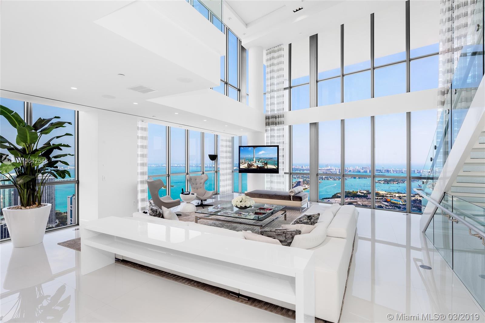 Located at the Marquis in the heart of downtown Miami this 4-Story Penthouse is the pinnacle of luxury living. No expense spared in the 8,000+SF residence. Open flowing living, dining & family areas, illuminated stairs, interior elevator, white glass tile floors, soaring ceilings, approx. 2,000 SF terrace with a private rooftop pool on 67th floor overlooks the city. Breathtaking unobstructed views as far as the eye can see to Biscayne Bay, Atlantic Ocean, Miami Beach & Downtown Miami – must see to believe. The entire 3rd level is the principal suite w/bar, voluminous dual walk-in closet, fireplace & amazing spa bath-all w/stunning views. Centrally located, minutes to sports & cultural venues, entertainment, dining & shopping. 5-star Marquis Amenities complete this offering.