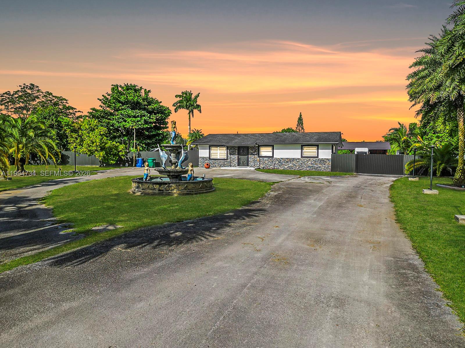 Welcome to this beautifully renovated property. The main residence features 4 bedrooms & 2 bathrooms across 1,885 sq ft, complemented by a fully upgraded guest house offering 2 bedrooms & 1 bathroom within 1,400 sq ft., ideal for multi-generational living or guest accommodations. The home showcases high-end finishes, including quartz countertops, natural stone accents, stainless steel appliances, and modern LED lighting. Impact-resistant doors & windows, electric blackout and zebra blinds. Outdoor living is unparalleled, featuring a resort-style pool with a dedicated children’s area and Jacuzzi, covered ranch-style patio with an insulated roof—perfect for entertaining. Chef-style outdoor kitchen with BBQ. Welcome to your dream oasis! *** Conveniently located just 7 minutes from the new location of the famous KNAUS BERRY FARM, one of South Florida’s most iconic spots for the best cinnamon rolls, delicious shakes, baked goods & more ***
