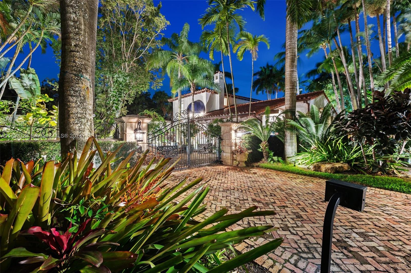 Entrada Estates Coconut Grove. Counted among just 32 homes in a gated community, this Miami original delivers a 21st-ctry luxury lifestyle while maintaining its priceless historic charm. Set on a lushly landscaped & supremely private 1/2 acre, the home’s meticulous renovations incl. a 1st flr Charles Pawley primary suite, marble/wood flrs, a Great Room, wine room, Smart Home system, separate guest house, vaulted ceilings, a fireplace, impact windows & doors, a full-house generator & so much more! The waterfall swimming pool w/open-air cabana puts the finishing touch on this serene oasis. The village is cherished for its active yet laid-back bayfront lifestyle, a rapidly expanding entertainment scene, proximity to A+ schools, and quick access to Downtown, The Beaches & Miami Int’l Airport.