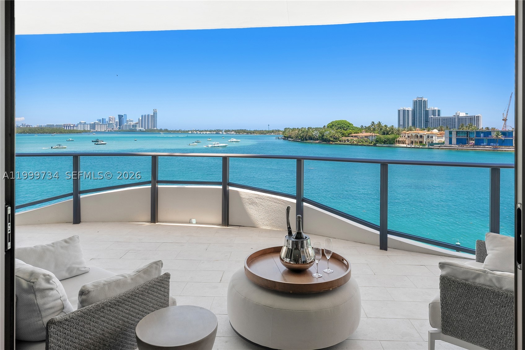 Step into quiet, effortless luxury at Onda, Bay Harbor Islands’ most exclusive boutique building with just 41 residences and an atmosphere of refined elegance and high-level privacy. This gorgeous designer-finished 2-bedroom + den, 3-bathroom home offers 2,177 SF of interior space, where a private elevator opens to a foyer and an expansive living area framed by spectacular, unobstructed views of the turquoise bay. The multifunctional enclosed den offers flexibility, serving perfectly as a 3rd bedroom, private office, or media room. The open-concept split floor plan, furnished in contemporary style by BoConcept, is ideal for both elegant entertaining and serene everyday living. The home features gourmet Snaidero kitchen with marble counters and Miele appliances, motorized shades and  Statuarietto marble bathrooms. A large, deep 400SF terrace is perfect for lounging while taking in the breathtaking turquoise-colored open bay. ONDA’s boutique scale ensures a discreet, ultra-luxury lifestyle with a panoramic rooftop pool and hot tub, spa, steam, sauna, treatment room, yoga studio, Technogym fitness center, private marina, EV charging, two garage spaces, 24-hour valet and 5-star concierge. The building features a whole-building water filtration system designed for optimal wellness. Minutes to Bal Harbour Shops, St. Regis, beaches, A+ schools, houses of worship, fine dining—this is a rare opportunity to own a highly private bayfront sanctuary. Sold partially furnished.