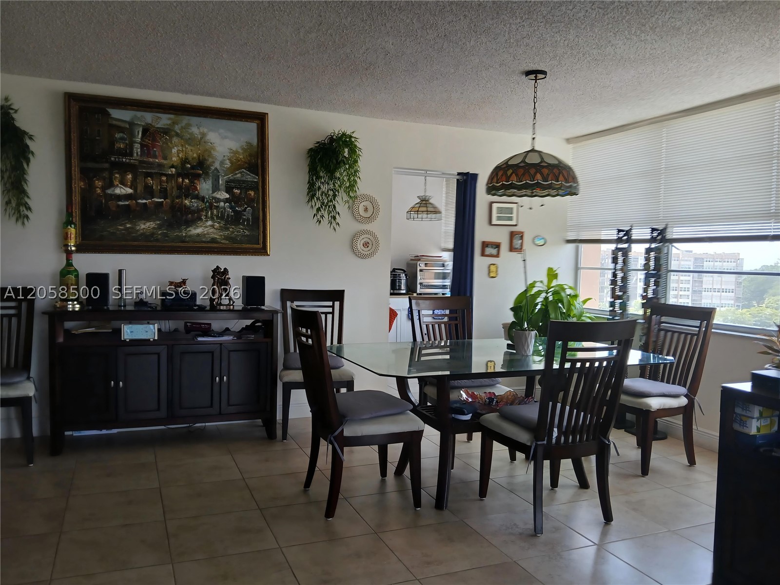 Corner Unit 2bed/2bath, 1120 sf. Located in the peaceful Park Place 55+ community resort style living.  Close to banks, malls, hospitals, main avenues & 20' to the beach. This bright & immaculate unit has tile flooring, stainless steel appliances & drop-down ceiling in kitchen, roller shades in windows, A/C & Water heater about 8years. Lots of closet throughout the unit & walking closet in master bedroom. Screened balcony perfect for coffee time and enjoying a peaceful & great view. Amenities include tennis/pickle ball courts, jog/bike path, 4 heated pools, sauna, BBQ area, clubhouse with activities & more. Space assigned in storage room & Laundry room same floor. Bike storage close to the pool area. This 55+ community is gated with 24/7 security.
