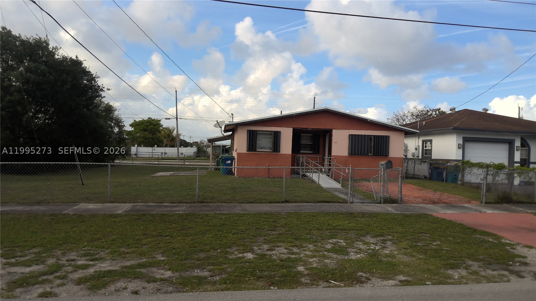 Step into a world of opportunity with this 4 bedroom, 2 bath home in Miami Gardens, ready for your personal touch! With a bright open floor plan and easy care tile floors throughout, this residence is a blank slate just waiting for your creativity and vision. A newer roof means the big expense is already handled, so you can pour your energy into making it shine. Enjoy a fully fenced yard with plenty of room to make it your own and bring your outdoor dreams to life. Perfectly situated near schools, shopping, transit, and the world famous Hard Rock Stadium, you will be right at the center of it all. Whether you are searching for your next home or your next investment, this is an opportunity you do not want to miss! NO OFFERS ACCEPTED WITHOUT A WALKTHROUGH, so schedule your private showing today and be first in line to make it yours. Your future is waiting!