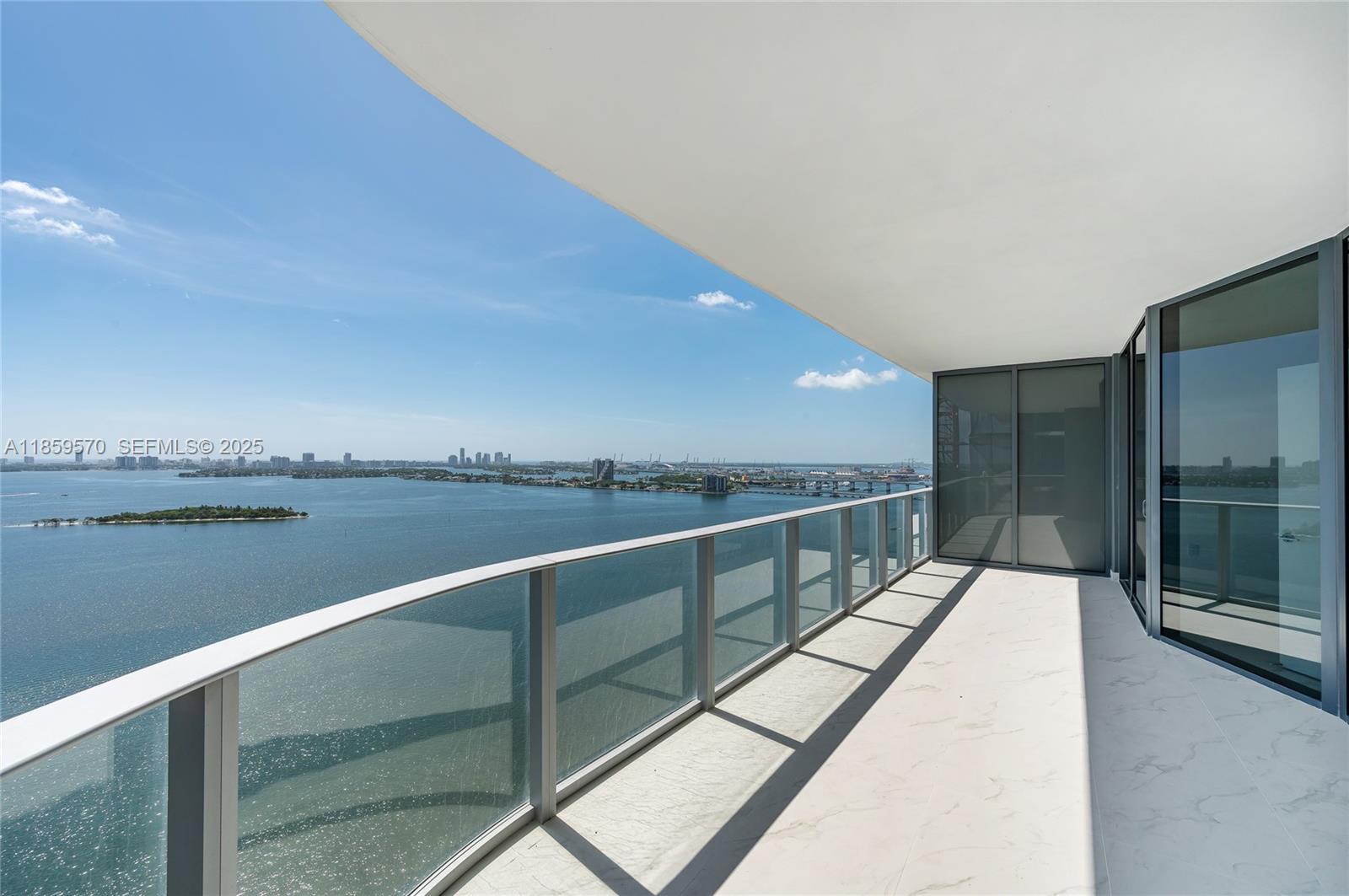 Residence 2501 at Aria Reserve is a 4-bedroom + den, 5.5-bath corner residence featuring over $130,000 in upgrades including designer lighting, motorized shades, custom closets, and premium fixtures. Floor-to-ceiling glass fills the home with light and captures unobstructed views of Biscayne Bay, the Atlantic, and the Miami skyline. A private vestibule with dual elevators provides exclusive entry, while each bedroom includes an en-suite bath. Residents enjoy 2+ acres of resort-style amenities and two side-by-side parking spaces. Private showings with 24-hour notice.