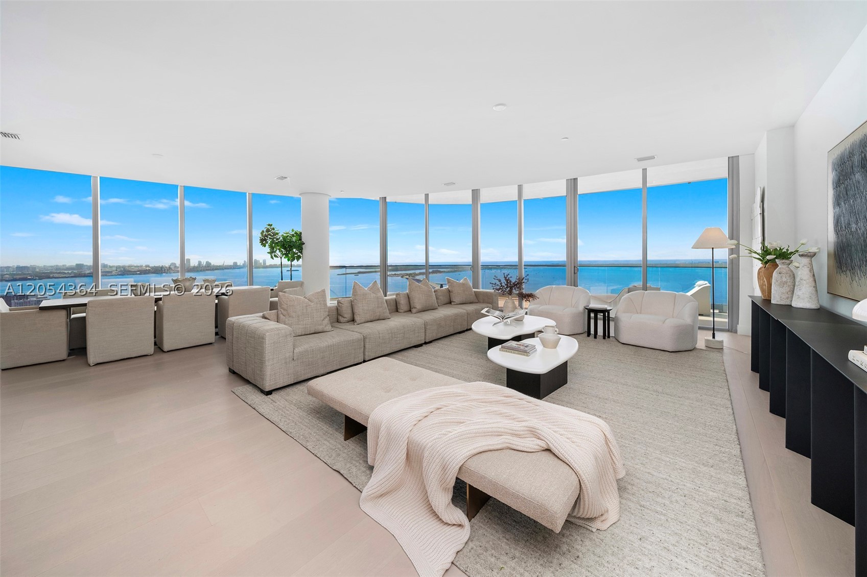 Half floor lower Penthouse with a one-of-a-kind customized floor plan and upgraded finishes. Completed in 2026 UNA Penthouse 4001 is an exceptional waterfront home in the sky with panoramic views of Biscayne Bay, the Atlantic Ocean, Key Biscayne, and Downtown Miami. Encompassing 4,725 SF of interiors and 797 SF of terraces, the residence features a custom floor plan with premium finishes throughout. A private elevator opens to expansive livings paces designed for entertaining and everyday living. The residence offers five bedroom suites, five full baths, onepowder room, generous living and dining areas, a media lounge, a full-service bar with a climate-controlled wine room, and a custom chef's kitchen with an oversized waterfall island and premium appliances. Italian-crafted custom millwork, upgraded wide-plank wood flooring, dropped ceilings for integrated lighting and audio, and refined finishes elevate the interiors. The primary suite features dual dressing rooms, spa-inspired bath, morning kitchen, and direct outdoor access overlooking the bay and skyline. Expansive terraces capture breathtaking sunrises and spectacular sunsets across the Miami skyline. Completing the residence are three assigned parking spaces and private storage. UNA Residences is Miami's newest premier waterfront addresses, offering bayfront pools, a state-of-the-art fitness center, spa, residents' lounges, concierge, valet, and 24-hour security, moments from Brickell, Coconut Grove, and Key Biscayne.