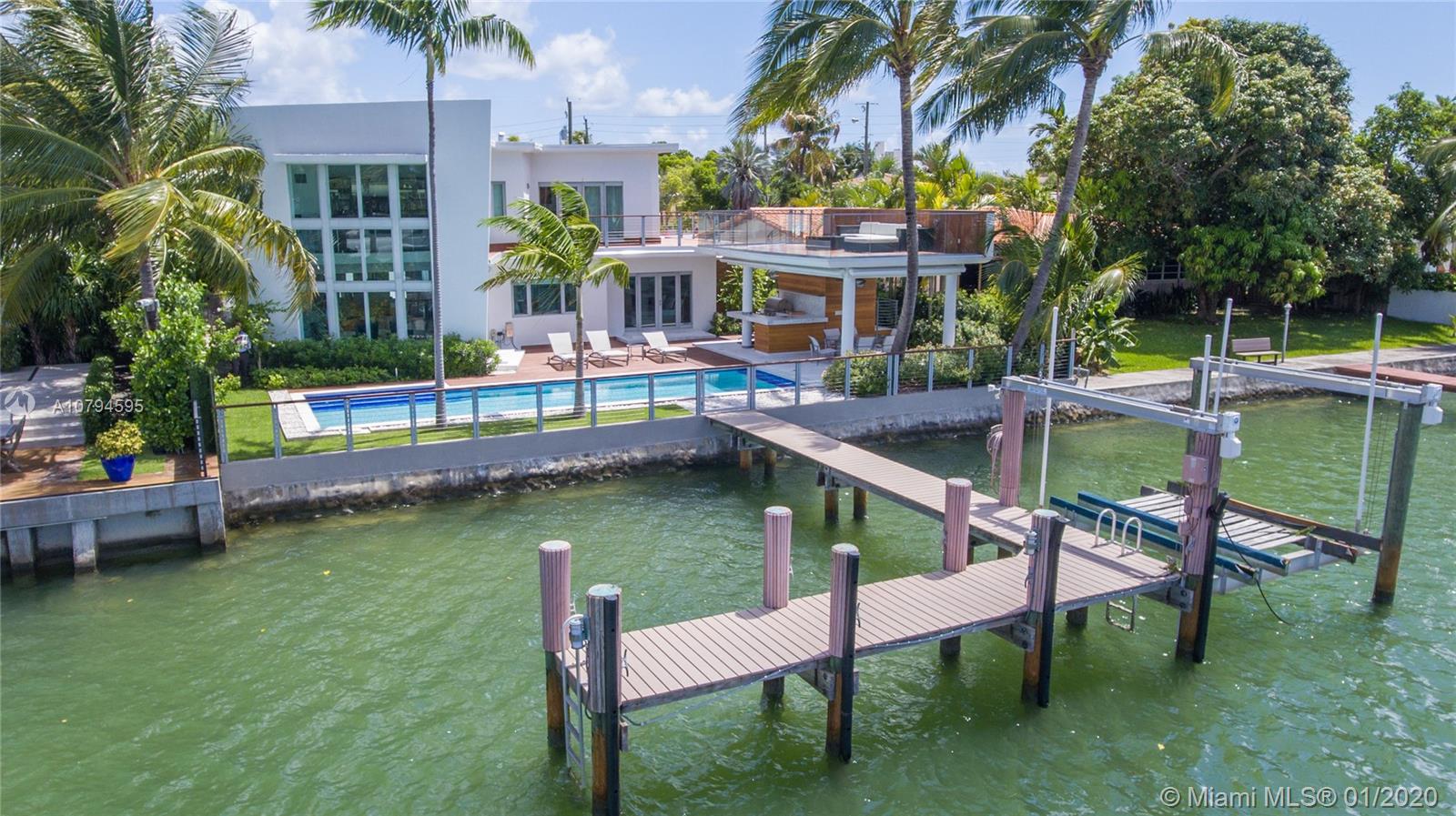 Live in ultimate luxury in this magnificent gated waterfront 6 bedroom, 6 bathroom new modern masterpiece. No details spared. 75’ Waterfront, 16,000 lbs boat lift. Heated pool, remote controlled window treatments, surround sound Sonos throughout home, Master bath with steam shower. Master bedroom on 1st Fl. Perfect for entertaining from pool deck to 2 story 1500 SF gazebo with wet-bar, bar-b-que, full bathroom/shower and expansive rooftop terrace. Located in Miami Beach Guard gated Biscayne Point Island. Home was completely remodeled in 2016. All 5 A/C units are new! HURRY....Priced to sell!!!