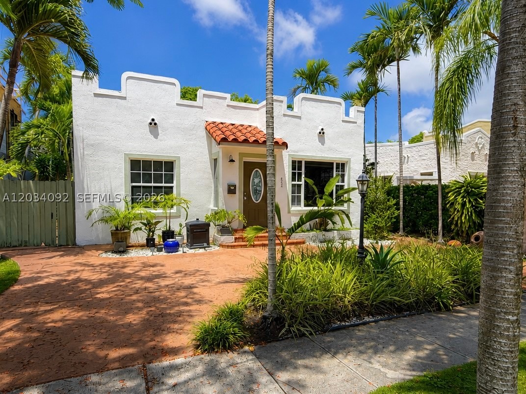Charming Old Spanish 2-bedroom, 2-bath home in the highly desirable The Roads neighborhood. Filled with natural light, this residence features a welcoming foyer, spacious formal living and dining areas, original hardwood floors, a decorative fireplace, and large windows throughout. The oversized kitchen offers ample cabinet and counter space and connects to a versatile sunroom ideal for a home office, breakfast nook, or reading retreat. Enjoy a private backyard surrounded by lush landscaping, perfect for relaxing or entertaining. Conveniently located just minutes from Brickell, Coral Gables, Key Biscayne, and Downtown Miami.