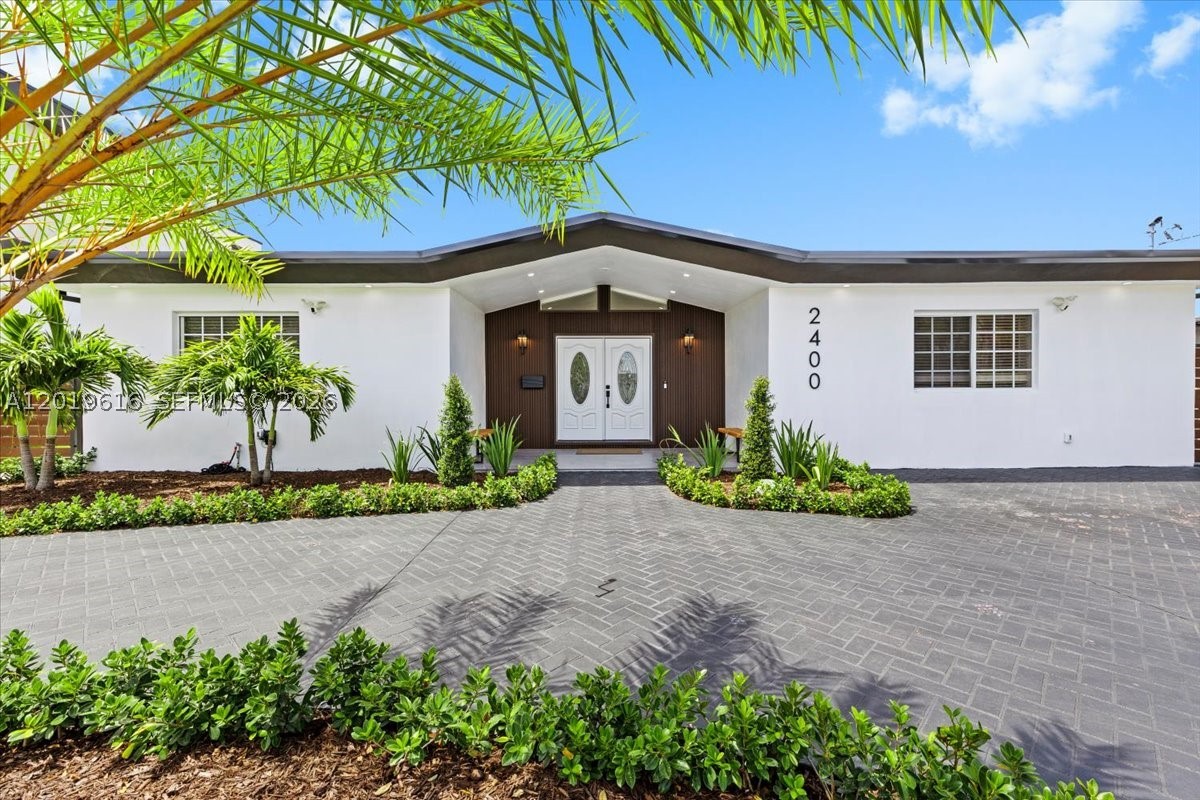 Fully renovated waterfront 4 bed/3.5 bath residence on a private cul-de-sac lot, where every detail has been thoughtfully curated. The open-concept interior showcases polished marble floors throughout the main living areas, soaring ceilings with recessed lighting, and a designer kitchen featuring granite backsplash, stainless steel appliances, and generous counter space. The layout flows effortlessly from the living and dining areas through glass French doors to an exceptional outdoor entertaining space. The thoughtful layout includes two primary suites and two additional bedrooms connected by a Jack and Jill bathroom. All four bathrooms have been completely transformed with floor-to-ceiling stone tile, frameless glass enclosures, and upscale fixtures. Outside, the resort-style backyard is anchored by a beautiful pool, heated Jacuzzi, and a custom wood-beam gazebo draped in café lighting, surrounded by lush tropical landscaping and full privacy fencing. The dedicated laundry room features front-load washer and dryer with upper cabinetry and utility sink. Located in one of Miami's most established residential corridors, minutes to Aventura Mall, I-95, the Turnpike, and both Miami International and Fort Lauderdale airports and great school area. This is the one that checks every box. Schedule your private showing today.