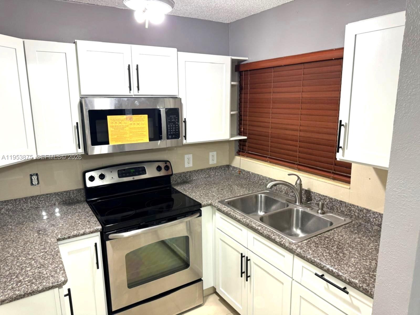Fantastic opportunity in West Hialeah! Spacious 3-bedroom, 1.5-bath condo featuring NEW A/C and appliances including refrigerator, microwave, washer, and dryer. Enjoy a private patio perfect for relaxing or entertaining. Conveniently located with easy access to major highways, schools, parks, and shopping. Includes 2 assigned parking spaces plus guest parking. Ideal for end-users or investors.