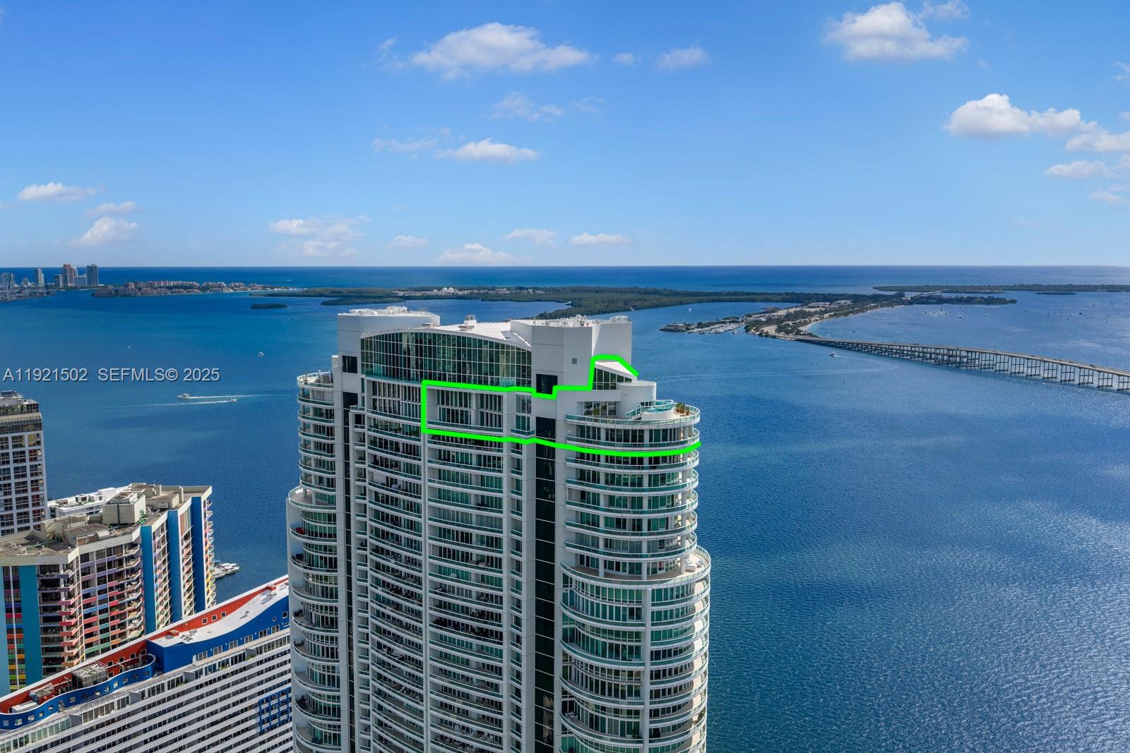 Experience unparalleled luxury in this breathtaking 2-story penthouse featuring sweeping 270° views of Biscayne Bay and the Miami skyline. Located on the 49th and 50th floors of the coveted Santa Maria in Brickell, this 10,000 SF sky mansion comes artfully staged with curated pieces from All About the Wow. The private primary suite wing includes its own terrace, dual spa-style bathrooms, and expansive walk-in closets. Additional highlights include dual-level floor-to-ceiling glass windows, multiple generous entertaining spaces including a bright sunroom, a gourmet chef’s kitchen with a butler’s pantry and premium appliances, and a private rooftop plunge pool with stunning panoramic views. Residents enjoy exceptional amenities, including a newly completed fitness center, spa, pool, tennis court, on-site restaurant, and 24-hour concierge. Boat slips are available for purchase.