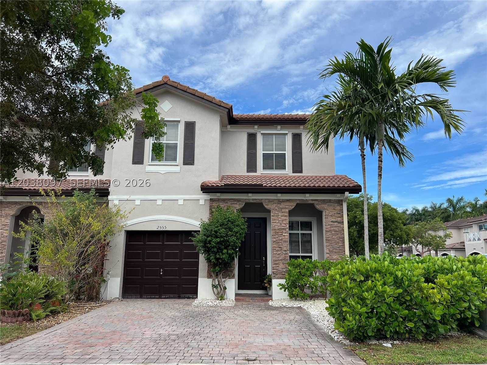 Stunning Corner-Unit Townhouse in Quiet Lakeside Community! Freshly painted exterior — this 3 bed/2.5 bath + den is the most spacious model in this well-maintained community. The open first floor features tile flooring throughout, stainless steel appliances, wood cabinetry, and a fenced garden patio ideal for entertaining or relaxing outdoors. Upstairs, gleaming wood floors run throughout (no carpet!) for a modern, upscale feel. The Primary Suite is a true retreat with a huge walk-in closet and spa-style bath with His & Hers sinks. Upstairs washer/dryer adds everyday convenience. Conveniently located at Coral Way & 147th Ave — walking distance to Publix, CVS, and Walmart, near Joe Hall Elementary, W.R. Thomas Middle, and G. Holmes Braddock Senior High, just 5 minutes to Tamiami Station Park & Ride and 10 minutes to the 836 for an easy commute anywhere in Miami. Current tenant in place through July 31st — available for move-in August 15th. Schedule your showing today!