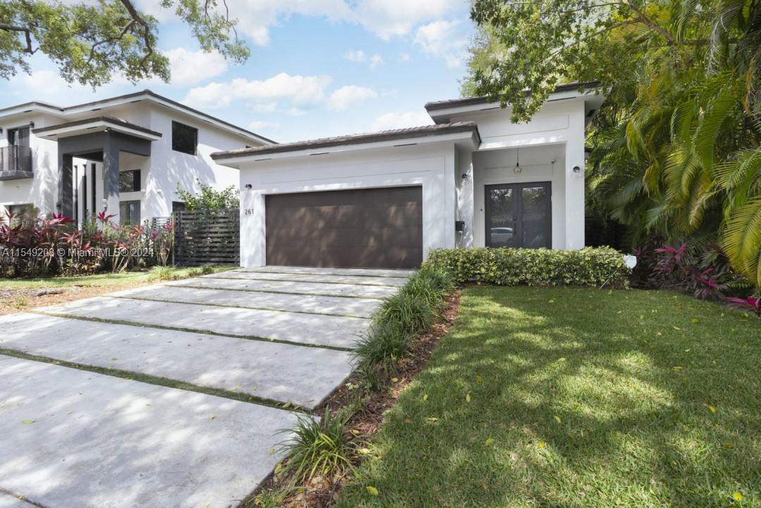 Introducing a rare find in this historic Miami Shores neighborhood. Built in 2020, this home offers the comfort of modern construction amidst the charm of Miami Shores. Open concept with 3 bedrooms, 2.5 bathrooms & 2 car garage. Located just blocks away from everyday conveniences, Pura Vida, Starbucks and major banks nearby, this home combines the best of urban and suburban living. Inside, you'll find tasteful finishes that blend elegance with functionality (quartz waterfall island, Spanish porcelain floors, etc.). Notable features include smart home technology: WiFi-enabled smart locks, dimmers controlled from your phone, festoon lights, Nest thermostat, & Google Home doorbell.