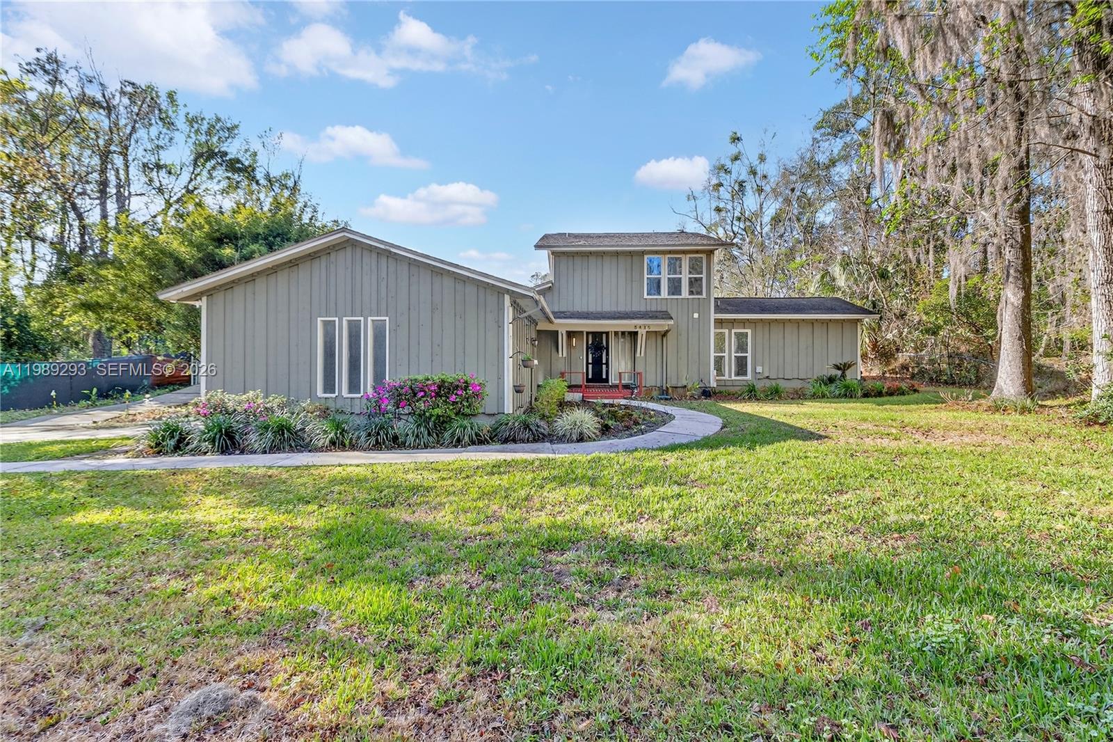 Well-maintained two-story 4BR/2.5BA home on a landscaped lot in northwest Gainesville featuring a rare, fully permitted 720 SF detached workshop/studio ideal for woodworking, art, hobbies, storage, home business use, fitness space or creative projects. The home offers over 2,000 SF of living space with a practical floor plan, natural light throughout and views of mature trees and established greenery. Interior spaces are functional and comfortable with defined room separation with three bedrooms upstairs and first floor master suite. Additional features include a large 2-car garage, shaded outdoor sitting areas, garden space and a private backyard setting. Conveniently located near UF, parks, shopping, dining, and downtown Gainesville. A unique opportunity for buyers seeking usable workspace, privacy, and outdoor character in northwest Gainesville.