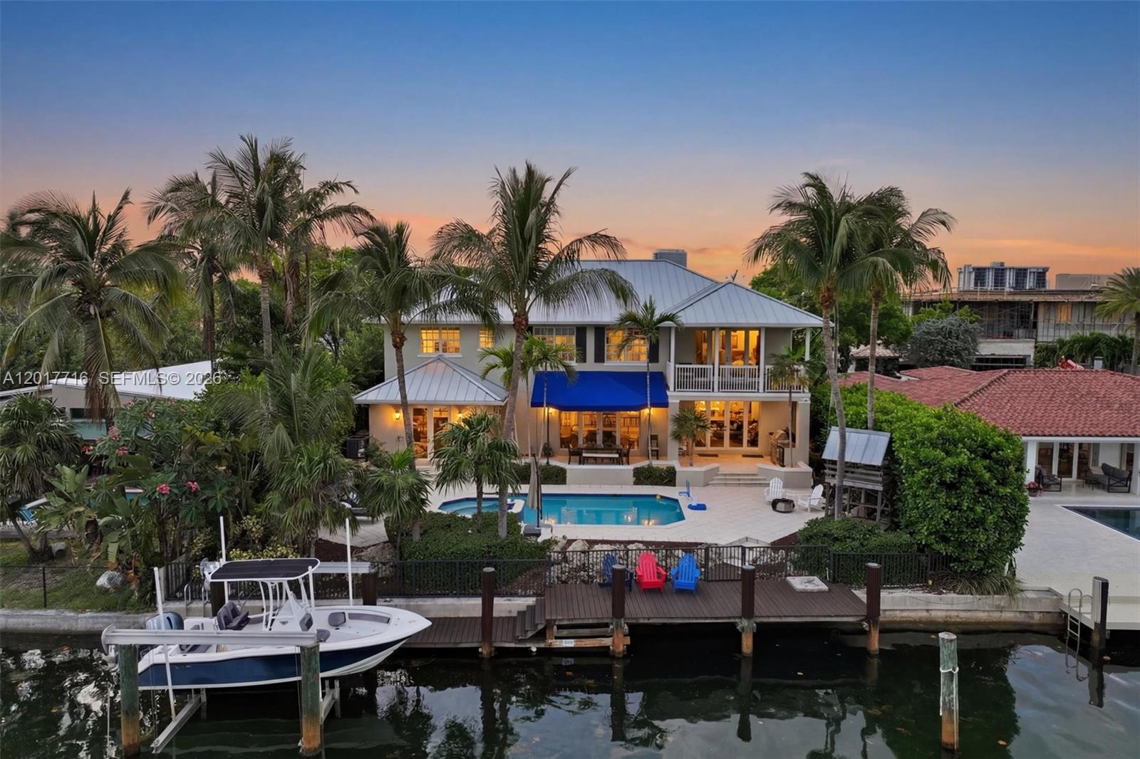 Welcome to Keystone Bay Vista, a stunning Caribbean Contemporary waterfront residence in the heart of Keystone Point, blending timeless coastal design with elevated luxury living. Ideally positioned just a few homes from the open bay, this exceptional property offers easy Biscayne Bay and ocean access with a private boat lift—perfect for embracing Miami’s elite waterfront lifestyle.

Featuring a metal roof, hurricane impact windows and doors, rich mahogany wood flooring throughout and soaring vaulted ceilings create an airy, light-filled atmosphere.

The chef’s kitchen is equipped with natural gas, premium appliances, and an oversized center island perfect for entertaining. The grand primary suite is a true retreat with an oversized walk-in closet with dressing island, spa-inspired marble bath with dual vanities, and a large private balcony showcasing breathtaking sunset and bay views.

Outdoors, enjoy a resort-style saltwater heated pool surrounded by swaying coconut palms, creating the ultimate tropical waterfront setting. A mature Florida avocado tree welcomes you at the front of the property, adding to the home’s lush South Florida charm.

Enjoy seamless indoor-outdoor living with tranquil waterfront surroundings, tropical breezes, and the relaxed elegance of a Florida Keys-inspired lifestyle. A rare offering for the quality-minded buyer seeking luxury, craftsmanship, and premier waterfront living in one of Miami’s most desirable gated communities.