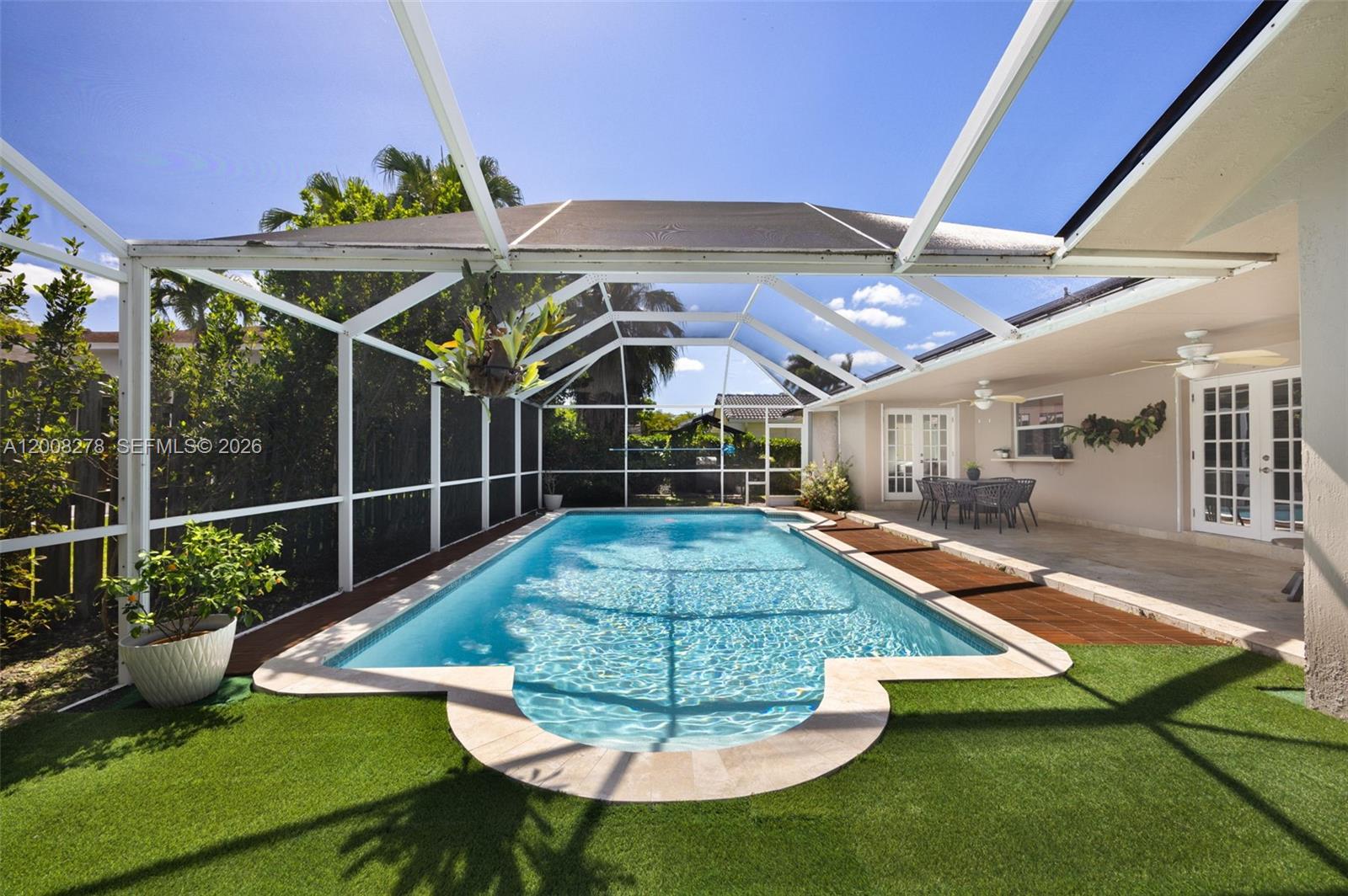 Turnkey Saga Bay pool home with over 2,500 SF under air and nearly 3,000 SF total—one of the largest floor plans in the community. This 3-bedroom, 2.5-bath residence features a bright, open layout with volume ceilings and a modern kitchen with stainless steel appliances flowing into the main living areas. A fully finished extra room delivers flexible space for a home office, media room, gym, or playroom—offering functionality well beyond the recorded 2,000 SF. Newer roof, updated bathrooms, and custom closet systems make this one truly move-in ready. Step outside to a private backyard oasis with synthetic turf, a sparkling pool, and dedicated BBQ area—perfect for year-round entertaining. Saga Bay offers lake access for kayaking and paddleboarding, lighted pickleball and tennis courts, a 5-acre park with playground, walking trails, and community security—all with one of the lowest HOAs in Cutler Bay. Minutes to A-rated schools, Black Point Marina, and US-1.
