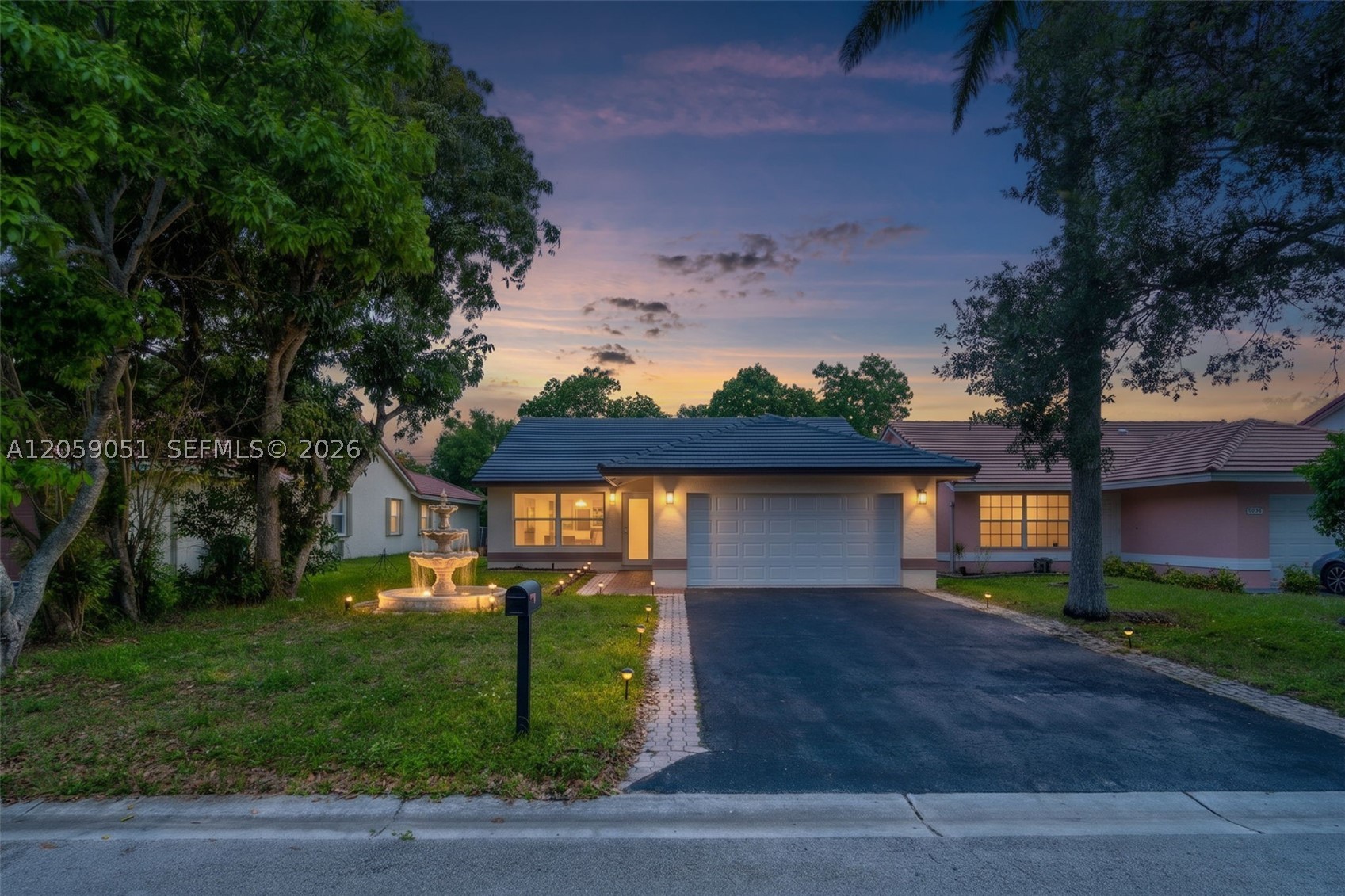 Welcome Home to Your Private Coral Springs Retreat!
Tucked on a beautifully landscaped homesite along a tranquil canal, this stunning Coral Springs residence blends timeless charm with move-in-ready polish. From the moment you arrive, the tile-accented roofline, circular paver driveway, and lush mature trees set the tone for what's waiting inside.
Step through the door into a light-filled, open-concept living space where soaring ceilings, recessed lighting, and gleaming tile flooring flow effortlessly from room to room. The updated kitchen anchors the heart of the home with a sleek island, crisp white cabinetry, and clean modern finishes — perfect for entertaining or quiet nights in. Generously sized bedrooms offer flexible space for family, guests, or a home office, while the spa-inspired bathroom impresses with marble-look porcelain tile, a glass-enclosed rain shower, and designer fixtures.
But the real showstopper? Step outside to your expansive screened lanai, crowned by a striking wood vaulted ceiling — an entertainer's dream year-round. Beyond it, your fenced backyard opens to serene canal views framed by mature trees — privacy that's increasingly rare to find.
Ideally located in a sought-after Coral Springs neighborhood, this home offers the perfect balance of tranquility and convenience — near top-rated schools, parks, shopping, and dining.
This is more than a house — it's a lifestyle. Schedule your showing today; homes like this don't last long!