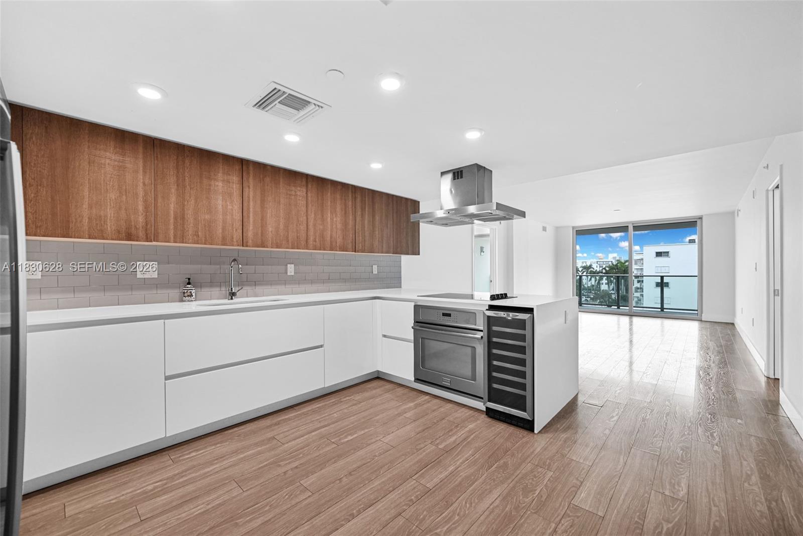 Live the Bay Harbor Islands lifestyle in this elegant 2-bedroom residence with a flexible den ideal for a home office or guest space. Floor-to-ceiling windows bathe the interiors in natural light, while an expansive balcony creates a flow between indoor comfort and outdoor relaxation. The gourmet kitchen is outfitted with premium appliances, perfect for everyday living or entertaining. Thoughtfully designed walk-in closets and spa-inspired bathrooms. The building offers resort-style amenities, including a rooftop pool, jacuzzi, lounge areas, and BBQ grills with panoramic views of the water and skyline. Fitness center, two assigned parking spots, and in-unit storage. Ideally located across from a park in a pet-friendly, walkable neighborhood—minutes from the beach, fine dining, and shopping
