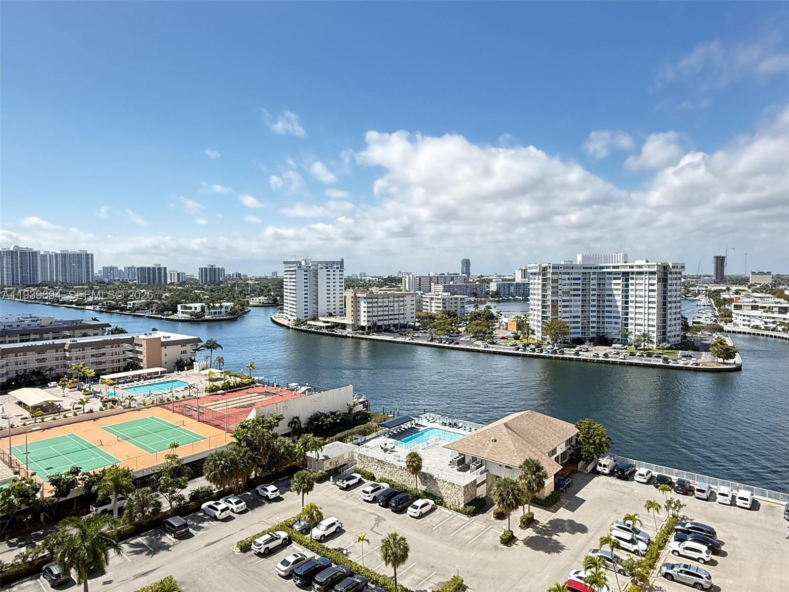 Fully renovated 1,360 sq ft corner unit with incredible ocean and Intracoastal views from nearly every room. With no neighboring units in sight, this residence offers exceptional privacy and an open, airy feel. Impact doors and windows provide safety, efficiency, and sound reduction. The living room features a modern LED drop-down ceiling and automatic blinds, creating a sleek and contemporary atmosphere. Blinds are installed throughout the unit. The open layout flows seamlessly, ideal for comfortable everyday living. The primary suite is spacious and modern, highlighted by a custom LED ceiling design and a spa-style master bathroom with a Jacuzzi bathtub and separate shower. Washer and dryer hookups add everyday convenience. The building offers a renovated pool area overlooking the Intracoastal canal, enhancing the resort-style living experience. This turnkey residence combines modern finishes, privacy, and stunning dual water views in a well-appointed beachfront building.