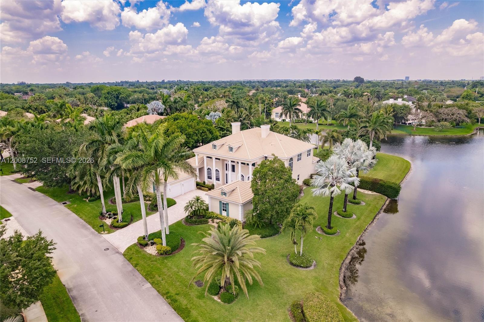 Enjoy wide water views spanning over 180 feet from this premium corner lot on a builder’s acre.  Located in the prestigious boutique, manned-gated community of Stonebrook Estates. Entering the market for the first time, this Colonial-style two-story home offers 6 bedrooms, 5.5 baths, plus an office and a flex space. Features include Grand double vaulted ceilings, a 4-car garage, high-impact windows, a generator, and gas appliances. Community amenities include a clubhouse with a fitness center, media room, party room, playground, and courts for tennis, pickleball, basketball, and volleyball. Owner states home is larger than reflected in tax records.