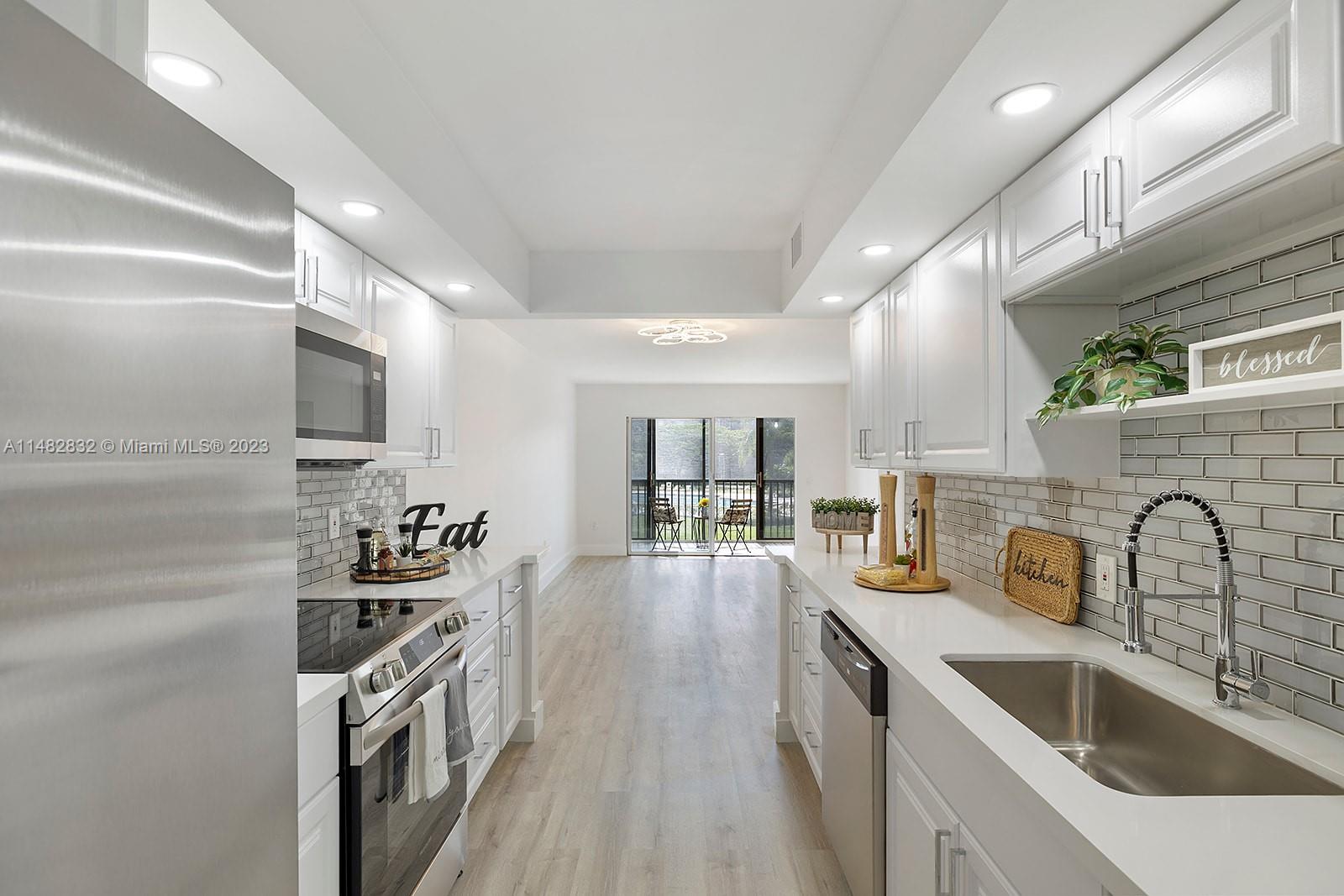 Walk into this bright & spacious remodeled condo located in Garfield at Century Village. 2 bedroom & 2 bath with a special and modern touch for you to come to live your golden years! This beautiful condo features a new kitchen w/new top-of-the-line SS appliances, wood cabinets & quartz countertop. Large bedrooms, completely renovated bathrooms & walk-in closet in the master bedroom. Brand new vinyl floors & LED Lights throughout. Washer & dryer inside the unit. New A/C. Beautiful view to the pool. Total HOA $549 includes water, cable, Internet, w/endless amenities: A million-dollar clubhouse. This 55+ community is extremely active w/on-sight golf, tennis, pools, & much more. It offers free transportation to it's residents. Conveniently located near shopping, restaurants & others.