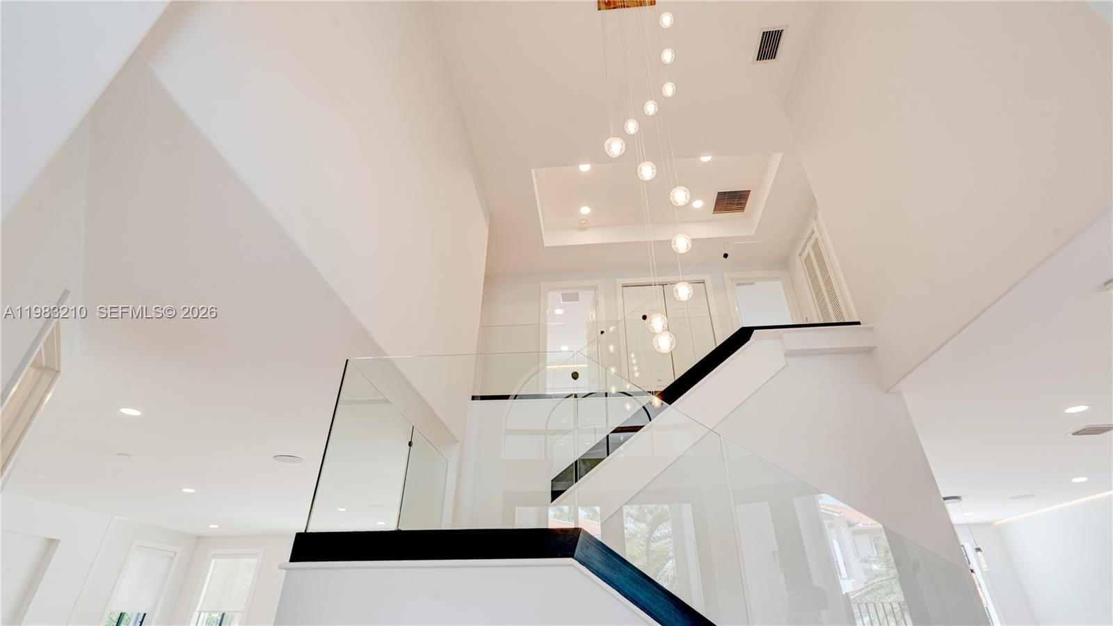 Completely renovated luxury home with high-end finishes, designer details, premium smart-home features throughout. This exceptional residence offers a modern, light-filled design w/everything completely new, combining contemporary elegance with comfort, functionality and resort-style outdoor living. Main Features are:
Fully newly renovated with luxury finishes & equipment throughout; Bright, modern interior with light tones & warm wood accents; Waterproof luxury vinyl flooring; Contemporary glass staircase; In-ceiling ambient LED light strips in every room; In-ceiling speaker installation; Kasa smart dimmer switches throughout the home, controllable via Alexa; Separate guest house w/ private bathroom; Beautiful pool area w/ lush tropical landscaping; Tikki Hut tropical patio lounge; Designer kitchen w/ premium finishes & thoughtful custom details: Thick marble countertops; Light-color palette with elegant wood elements; Large kitchen island w/ integrated LED lighting; Induction cooktop with hood; Soft-close cabinetry throughout w/ BLUM hinges; High-end interior cabinet drawer organization for cutlery, spices & more; LED-lit shelving; Wine cooler; Luxury bar sink with premium accessories, including waterfall faucet, cutting board; Spacious pantry w/ ample storage & Motion-sensor shelf lighting, all bathrooms have Floating vanities- Primary has double; LED vanity mirrors; Marble showers w/ glass enclosures; Smart toilets w/heated seats, automatic flush, 2 NEW CENTRAL A/C UNITS