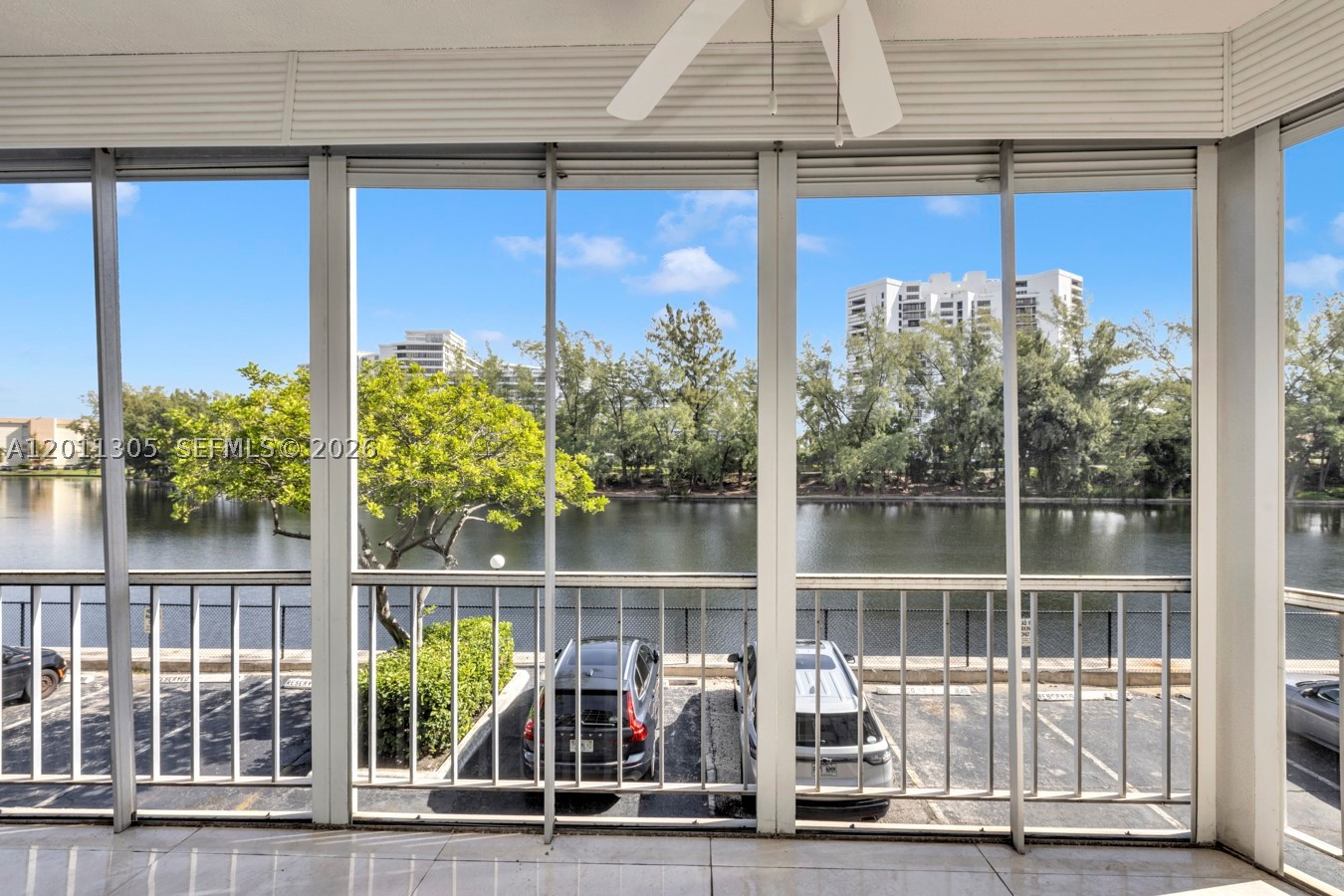 PRICED TO SELL! Enjoy stunning water views in this renovated condo. The open-concept layout features porcelain floors, a modern kitchen with granite countertops, backsplash, cooking island, stainless steel appliances, food disposer, smart AC control and security camera. The master suite is designed for comfort, the bathrooms are updated with marble countertops, glass shower doors, and a dual-sink in the master bath. Relax on the screened balcony and enjoy natural light throughout, along with impact windows and doors, plenty of closet space, and extra ground-floor storage. Resort-style amenities include a waterfront pool, fitness center, saunas, game room, laundry facilities on each floor, and a sundeck with barbecue grills. Just one mile from the beach and minutes from shopping, dining, and entertainment.