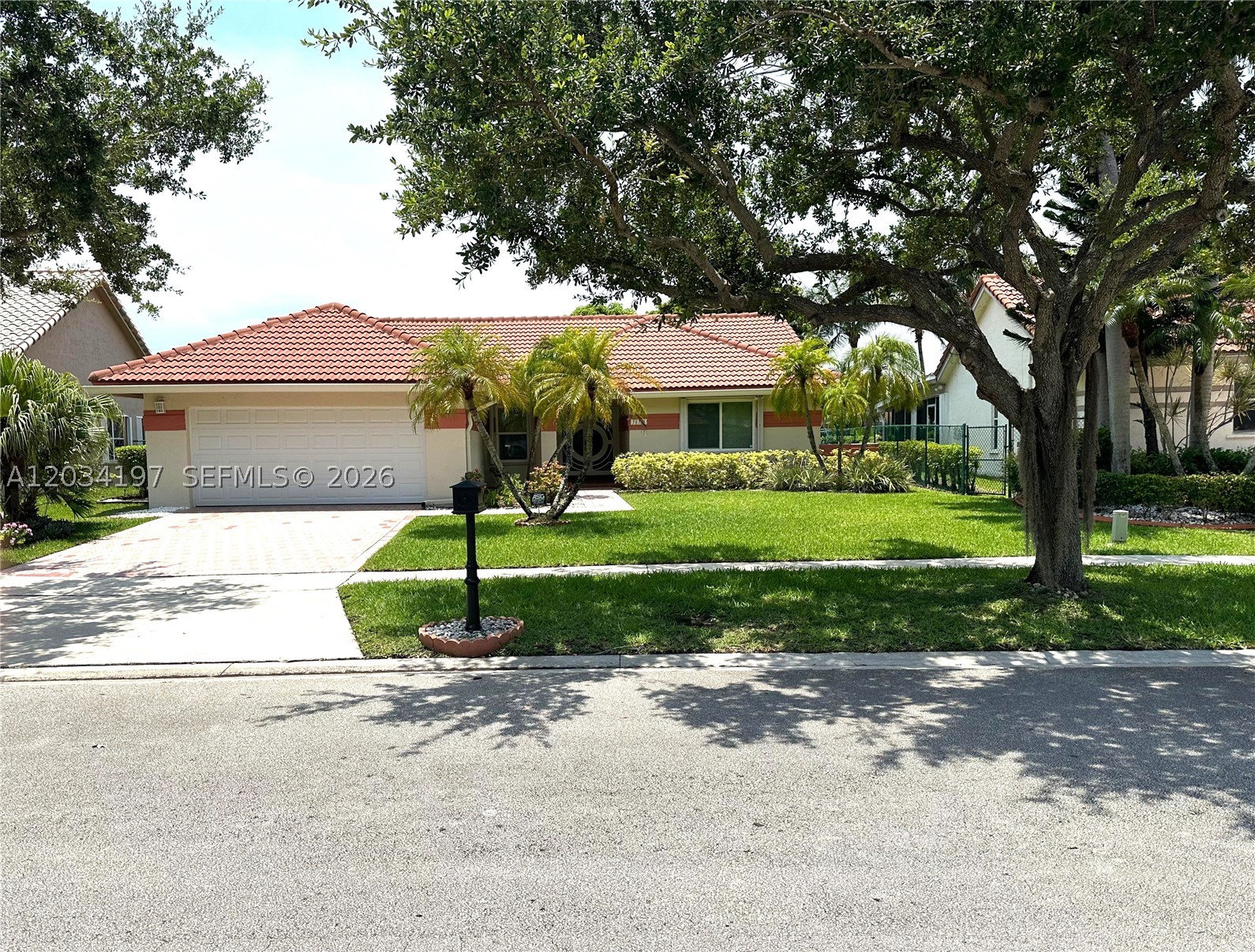 Lakefront 3BR/2BA in Spring Valley, Pembroke Pines. Vaulted smooth ceilings, open layout, and a custom fireplace create a bright and inviting living space.
Updated kitchen and renovated primary bath with jacuzzi tub. Tile flooring throughout, impact windows and doors, zebra window treatments, shutters, and hurricane-rated garage door. Roof and gutters (6 yrs) and A/C (4 yrs).

Brick paver driveway and entry, plus a screened and tiled lakefront patio—perfect for relaxing or entertaining. Fruit trees and a lake-fed sprinkler system add to the outdoor appeal.

Prime location near top schools, hospitals, shopping, dining and major highways.

A beautifully upgraded home with serene lake views—don’t miss this opportunity. This home is move in ready!