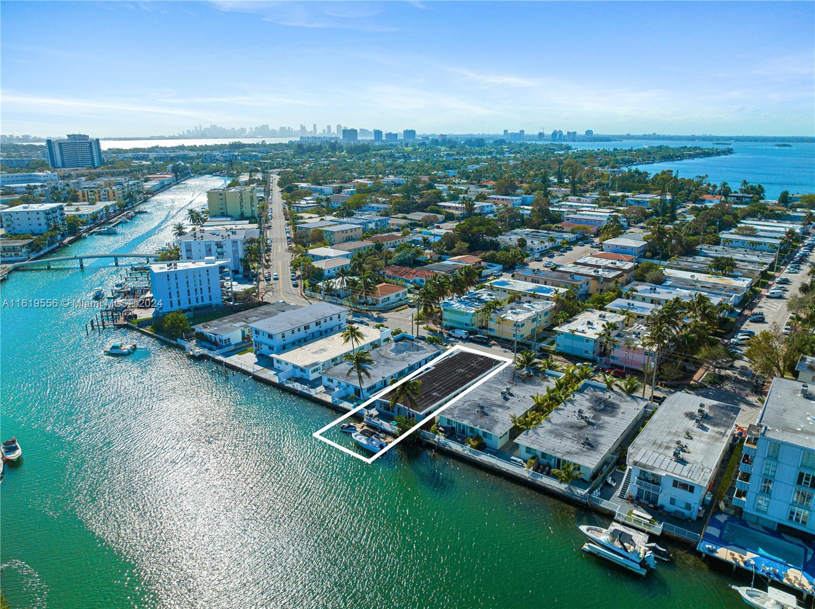 Waterfront Miami Beach development potential! Currently a duplex this 2-unit multi-family development offers waterfront views, a private dock with one fixed bridge access to the ocean. The neighborhood is undergoing redevelopment with many new high rise and retail buildings under construction nearby on the 79th causeway and $2 billion investment on nearby Ocean Terrace. Current rent roll below market $7750. Buildable square footage max FAR 1.25, which allows 7,188 sq feet living and five stories high. There is city notice requiring the owner to permit and build a common area laundry which the seller says will cost $25,000 but seller says this is a buyer responsibility to build if they keep the structure, but $0 cost if they knock and build new. Seller will only accept full price offer.