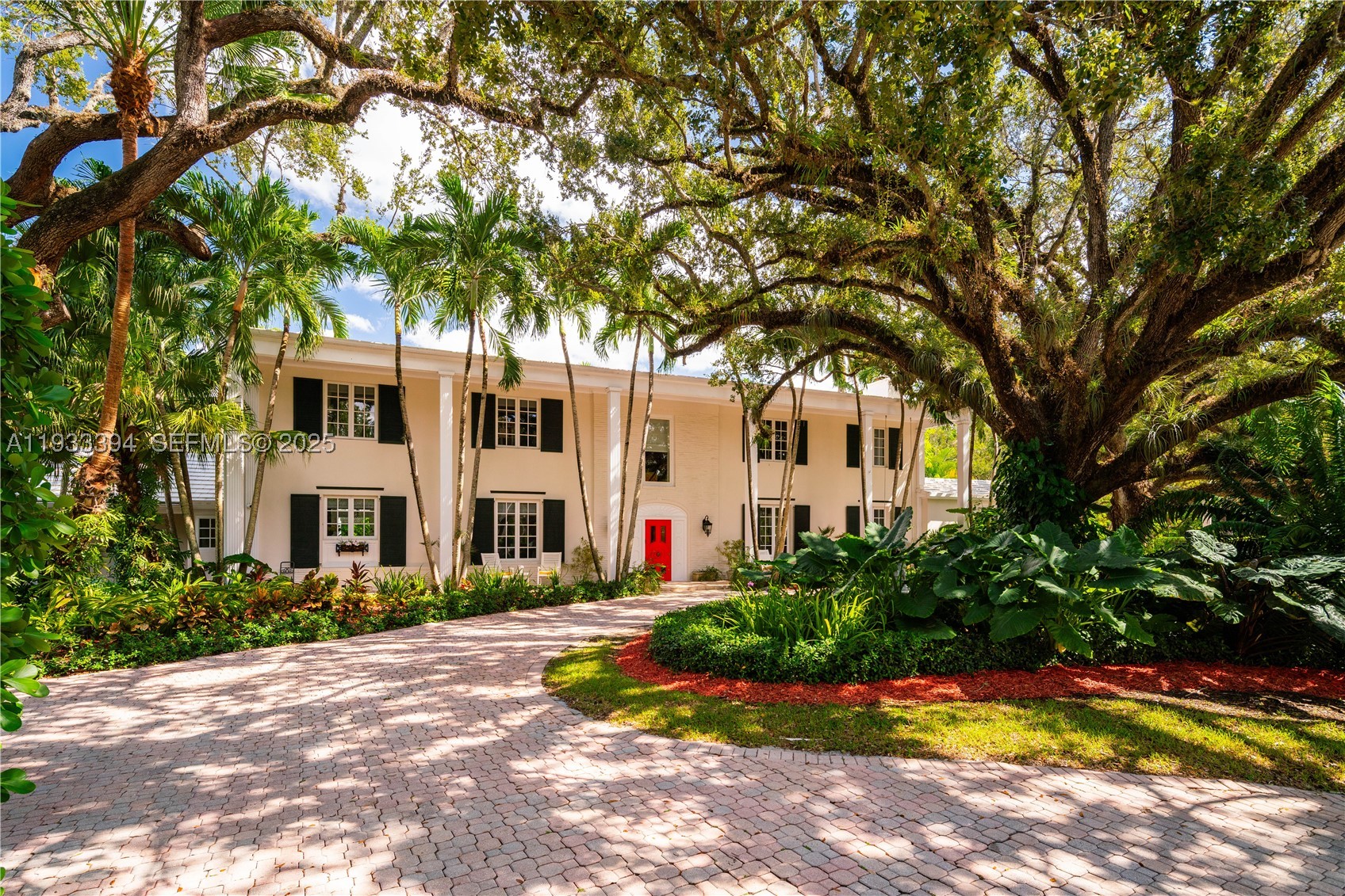 Tucked within the exclusive, gated enclave of Ponce Road Estates—home to only five residences—this Ponce-Davis estate is truly the crown jewel. Set on a generous 3 / 4-acre lot, the 6-bedroom residence (plus home office) showcases exquisite craftsmanship and thoughtful details at every turn. Refined moldings, impact glass, a beautifully remodeled island kitchen with Viking gas range, dual ovens, dual sinks, and a walk-in pantry, along with tastefully updated bathrooms, speak to its elevated design. The primary suite is Architectural Digest–worthy, featuring a spa-inspired bath and an enviable, Instagram-ready closet. Enjoy movie nights in the private media room, morning workouts in the gym, or al fresco gatherings on expansive terraces and balconies overlooking lush, mature gardens. The pool, patio, and summer kitchen create an idyllic backdrop for unforgettable entertaining. An oversized two-car garage and covered carport add convenience, while the community’s own tennis, pickleball, and basketball court complete this rare offering. Located within the super desirable A+ rated Sunset Elementary School. Per appraisers calculations, total living area is 5,521', total adjusted area is 6,313' and  total area under roof is 7,937'.  A Very Special Home.