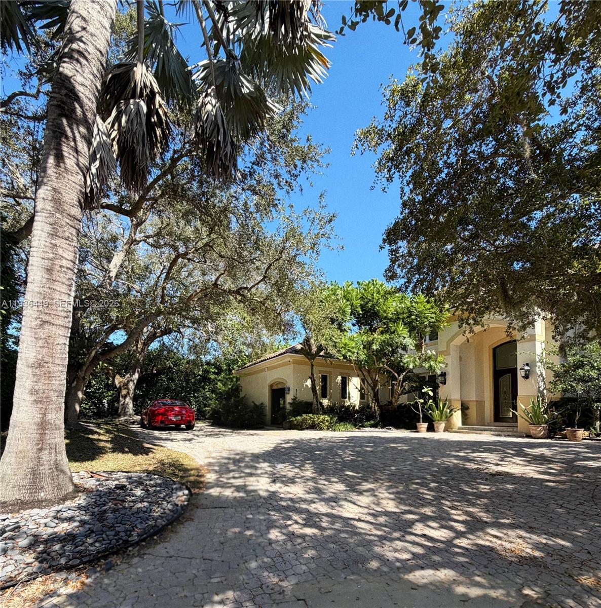 Strategic Price Repositioning

PRIVATE OLD CUTLER OAKS ENCLAVE
Completely Renovated in 2025 | Timeless Elegance in an Exclusive Gated Setting

A stately custom residence tucked within Private Old Cutler Oaks, an intimate, gated enclave of just 15 distinguished homes, complete with a private tennis court and set on a quiet, picturesque cul-de-sac. This is refined Pinecrest living at its absolute finest.

Thoughtfully renovated in 2025 with impeccable taste and uncompromising quality, the home makes an unforgettable first impression. A grand foyer opens to a breathtaking double-height formal living room, immediately establishing a sense of elegance, volume, and architectural presence. A gracious formal dining room flows seamlessly, ideal for elevated entertaining.

The gourmet chef’s kitchen is beautifully appointed and opens to a sun-filled breakfast area and an expansive family room—perfect for both effortless daily living and memorable gatherings. High-impact windows and doors and new light oak flooring enhance the entry, common areas, hallways, and powder room, while all bedrooms feature luxurious taupe carpeting for warmth and comfort.

The residence offers a private guest suite and a refined library/office, while the lavish primary suite serves as a serene retreat with a sumptuous, spa-inspired bath. Every bedroom is en-suite, showcasing open, tranquil vistas and custom built-ins throughout.