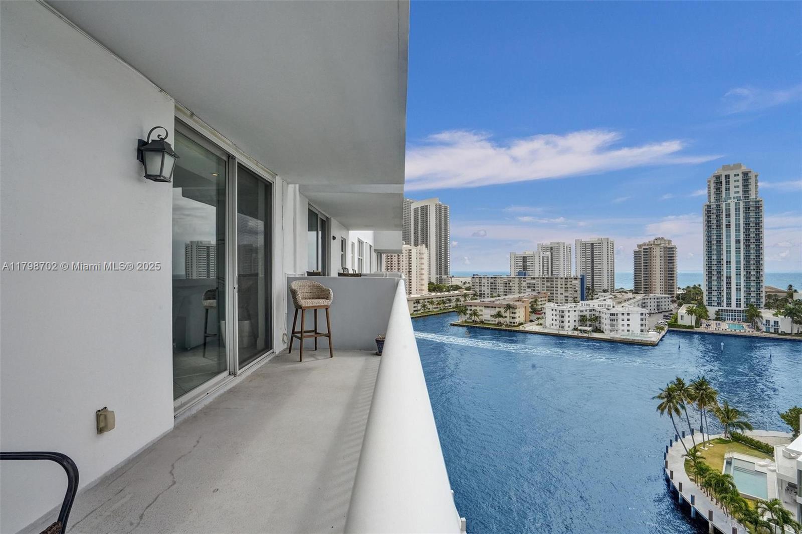 Welcome to your sanctuary in the exclusive Golden Isles community! This renovated unit offers over 1,300 sq ft of sun-filled space with sweeping views of the Intracoastal, Atlantic Ocean, and city skyline from every room. Enjoy coffee or sunsets from your expansive private balcony as boats cruise by. Interior features include an open kitchen with granite countertops, stainless steel appliances, spacious bedrooms with custom closets, split floor plan, tile flooring, impact windows, and updated bathrooms. The well-maintained renovated building offers boat dock slips, heated pool, BBQ area, covered parking. Building passed 50-year recertification, no assessments. Just minutes to the beach, shopping, dining, Gulfstream Park, Aventura Mall, and both Miami and Fort Lauderdale airports.