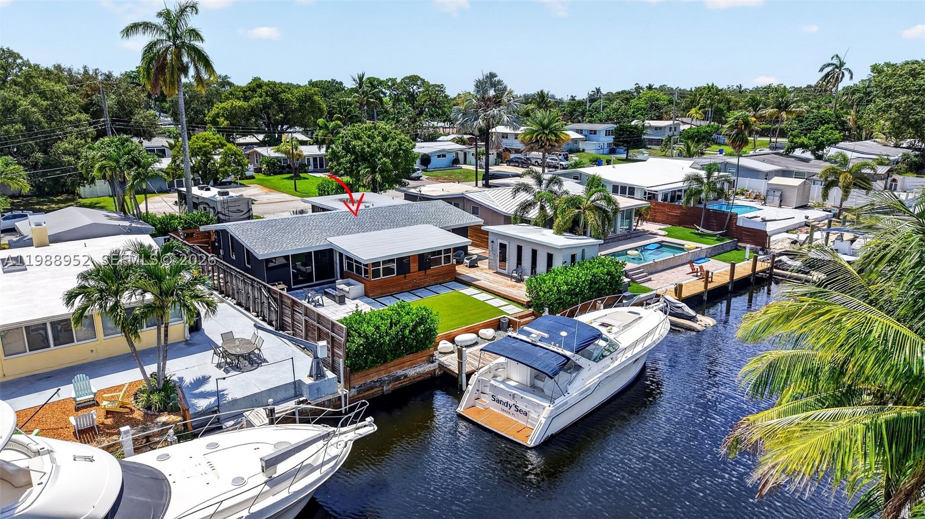Completely renovated waterfront home in Lauderdale Isles with ocean access and no fixed bridges. This 3BD/2BA home includes an additional 200' sq ft shed completely enclosed with drywall & recessed lighting. Fully reconstructed with permits: Roof (2024), new electrical lines/panels. New plumbing throughout including underground PVC lines, and tankless water heater. Open layout with vaulted ceilings. Beautifully renovated kitchen featuring a large island, white cabinetry, granite counters, and 36 inch double Subzero fridge & freezer—ideal for entertaining. Large flex space in primary bedroom ideal for custom closet build out & gym/office - bath with rain shower & fireplace over stand alone bathtub. Impact windows and doors!! New plank laminate flooring installed throughout main living areas. AC 2023. Elegant front courtyard entry offers privacy and tranquility. Enjoy 60’ of waterfront with dock equipped with 30/50 amp shore power. Stunning outdoor space with artificial turf, pavers, and firepit. Large driveway intentionally designed for RV/boat parking with two EV chargers. No HOA. Prime location near 595, I-95, FLL Airport, Las Olas, and quick boat access to the New River and Fort Lauderdale Beach. Seller financing available!!