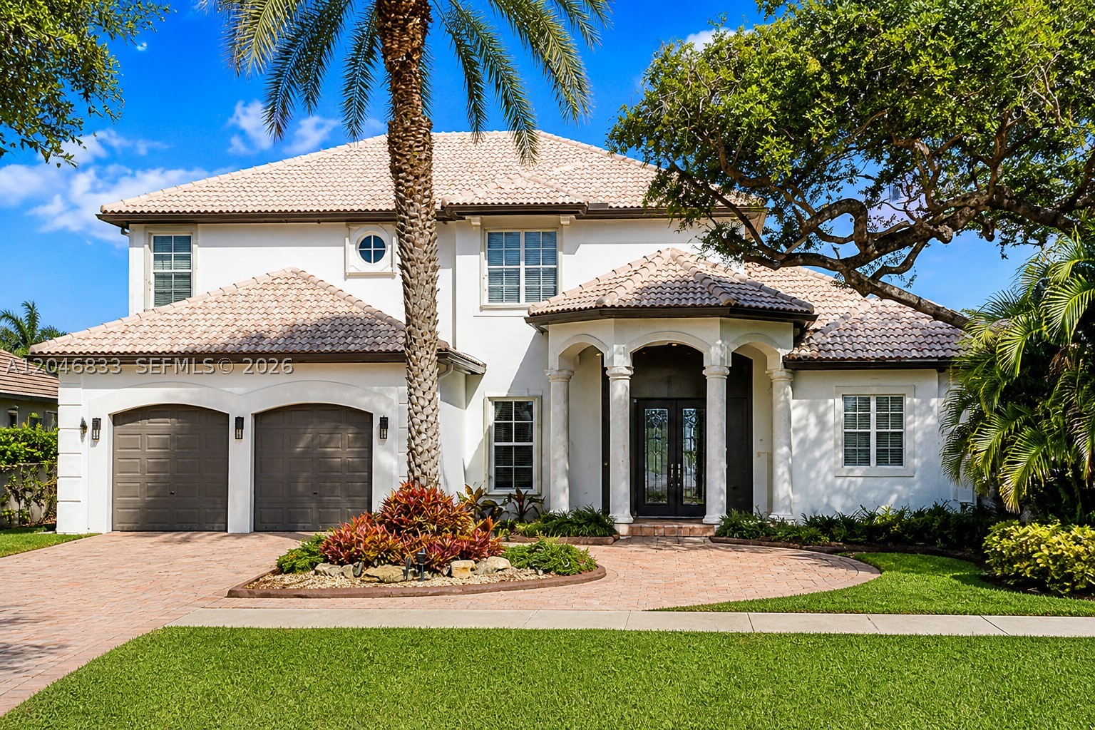 LAKEFRONT LIVING IN GUARD-GATED LAKE ESTATES AT ROLLING HILLS!  Experience this beautifully updated custom home with desirable eastern exposure, offering breathtaking sunrises and tranquil lake views. Freshly painted inside and out, the home features custom crown molding, refined finishes, and a spacious, functional layout. The first-floor primary suite is a private retreat with a remodeled spa-inspired bath, Roman tub, separate shower, and dual vanities. A versatile office/bedroom, formal dining room, living room, family room, and updated eat-in kitchen with 42" cabinetry, quartz countertops, and center island complete the main level. Upstairs offers a bright loft, Jack-and-Jill bath, and a desirable triple-split bedroom floor plan. Enjoy seamless indoor-outdoor living with a multi-slide patio door opening to the screened lanai, overlooking the remodeled pool and spa with updated patio, new heater, and pump. Additional features include **2 new A/C units, impact windows and rear sliders, surround sound, Hunter Douglas Hunter Douglas blinds, central vacuum, oversized 2-car garage, and optional Jandy saltwater pool conversion.** Low HOA includes a 9-hole golf course, cable, and alarm monitoring. Conveniently located near top-rated schools, shopping, dining, parks, major highways, and a new hospital. **A rare opportunity to own a beautifully appointed lakefront home in one of Davie's most desirable communities.