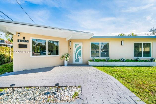 Discover your dream waterfront oasis in this beautifully updated 3-bedroom, 2-bath + den home offering modern living at its finest. Designed for both comfort and style, this move-in ready residence features impact windows and doors throughout, elegant ceramic tile flooring, and a completely new electrical system installed in 2026 for total peace of mind. The contemporary kitchen is a true centerpiece, showcasing sleek stainless steel appliances, modern cabinetry, and a stylish island that overlooks the sparkling pool—perfect for entertaining or everyday living. The open-concept layout is filled with natural light and flows seamlessly into sophisticated living and dining areas. Both bathrooms have been fully remodeled with modern finishes, creating spa-like spaces that elevate daily living. Step outside to your private backyard retreat and enjoy serene water views that provide tranquility and the ultimate Florida lifestyle experience. Whether relaxing poolside, hosting gatherings, or simply enjoying the peaceful waterfront setting, this home offers the perfect blend of design, functionality, and security. A rare opportunity to own a fully updated waterfront property ready to enjoy from day one.