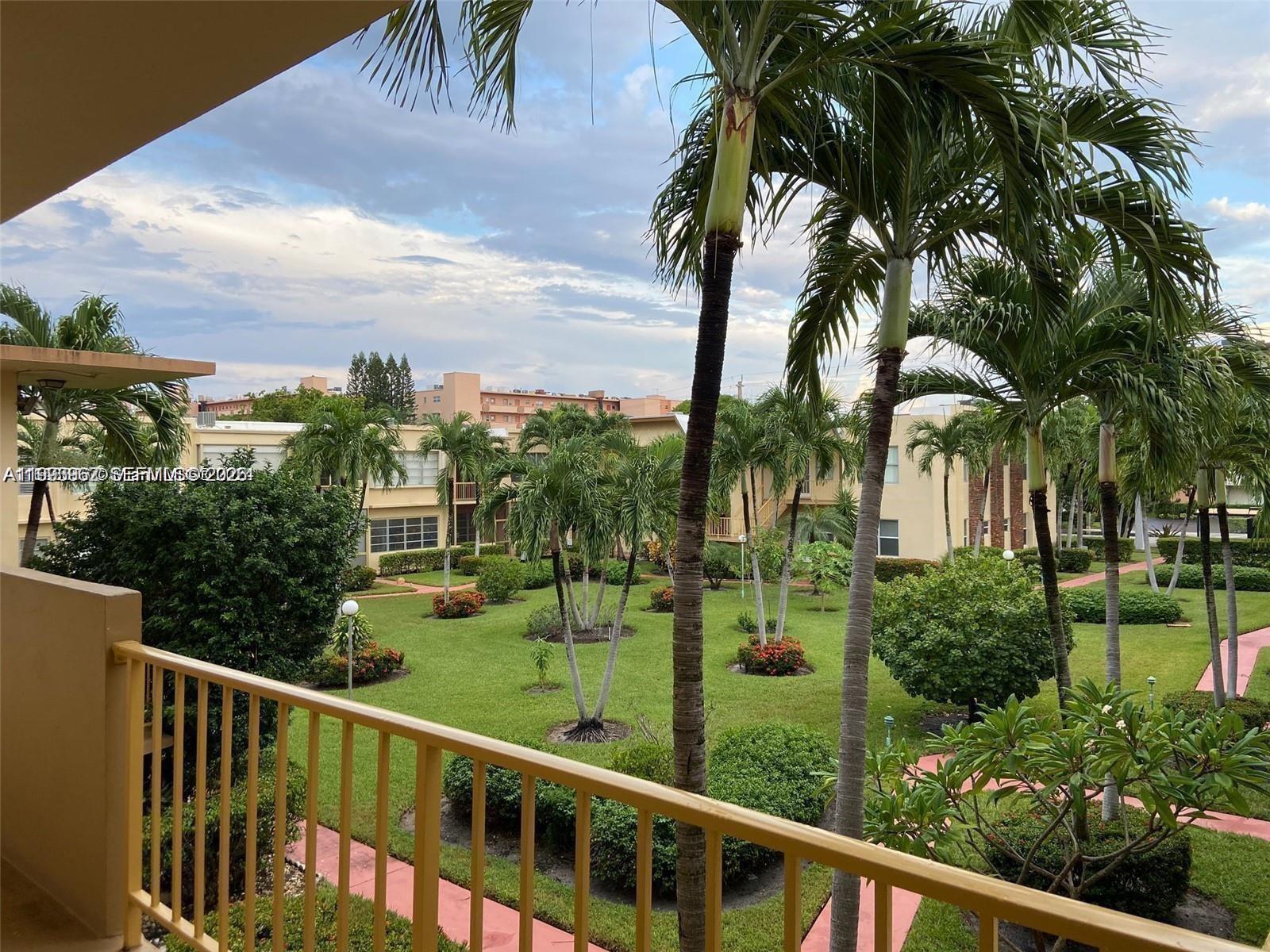 Welcome to your garden oasis located in Hallandale Beach! Nestled east of US1, with quick & easy access to grocery stores, dining, shopping and entertainment. Nearby you will find Gulfstream Park, Joseph Scavo Park, Aventura Mall, multiple shopping plazas and best of all just a short bike ride or drive to the beach! This 1 Bed & 1.5 Bath spanning a total of 1,071 sq ft has tons of natural sunlight flooding in through the large windows. Enjoy a spacious private terrace overlooking to the garden and pool area. Vast kitchen with a pass-through window connecting the space to the dining/living area. Building amenities include a pool, jacuzzi, clubhouse with ping pong & pool table, garden walking paths, sitting area, free-wifi within the amenities area and shuffleboard. Includes 1 assigned parking space, plenty of guest parking, and additional storage in the laundry room. BEST OF ALL THE BUILDING DOES NOT REQUIRE A SPECIFIC DOWN PAYMENT FROM BUYERS & 40-year certification has been completed. HOA Fee includes reserves. No Special Assessments.
