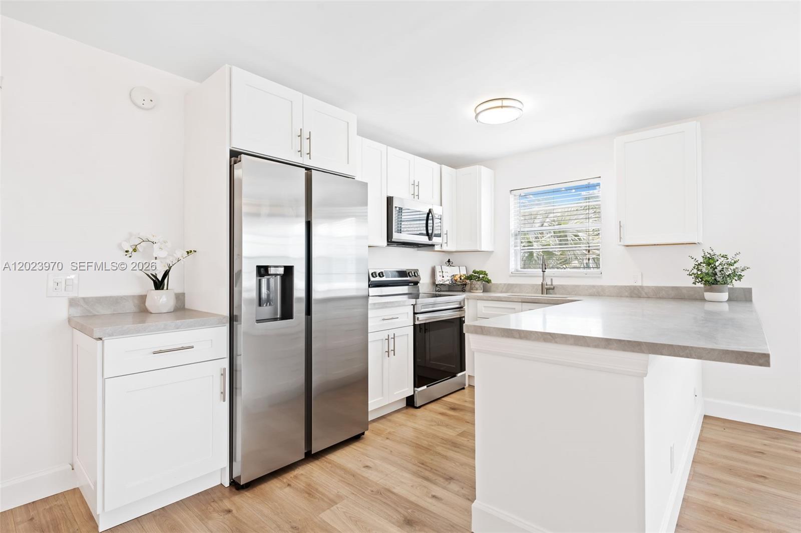 COMPLETELY RENOVATED!  Welcome to 17 Lyndhurst A in desirable Century Village Deerfield Beach! Ideally located just minutes from the beach with convenient access to I-95, the Florida Turnpike, and Sawgrass Expressway. This BEAUTIFULLY REMODELED corner unit features an open-concept floor plan, smooth ceilings, gorgeous laminate flooring throughout, quartz countertops, stainless steel appliances, and abundant natural light from extra windows. MODERN KITCHEN AND BATHROOMS. Enjoy peaceful pool views from this light and bright second-floor residence, easily accessible by elevator.

The kitchen and both bathrooms have been fully remodeled, and the building offers a BRAND-NEW ROOF along with freshly painted interior and exterior common areas. Community laundry is conveniently located on the second floor just steps from the unit.

Residents of this active 55+ community enjoy resort-style amenities including multiple swimming pools, pickleball, tennis courts, walking paths, social rooms, and more. Well-managed building with no rentals permitted and support animals only.

Schedule your private showing TODAY and experience this move-in-ready gem for yourself!