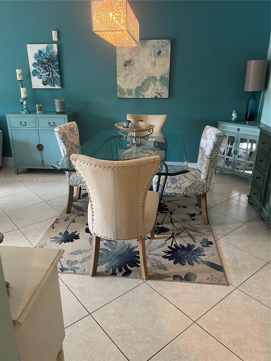 Beautifully updated 2 bed, 2 bath condo in the heart of Dadeland! This spacious second-floor unit features tile floors throughout, impact windows, and accordion shutters for peace of mind. Enjoy a bright kitchen with a new dishwasher and stainless-steel appliances. Primary suite offers comfort and style. Step outside to a large balcony overlooking lush green space—perfect for relaxing. Includes one assigned parking space conveniently located near the unit. Impeccably maintained—just bring your clothes and move right in!
