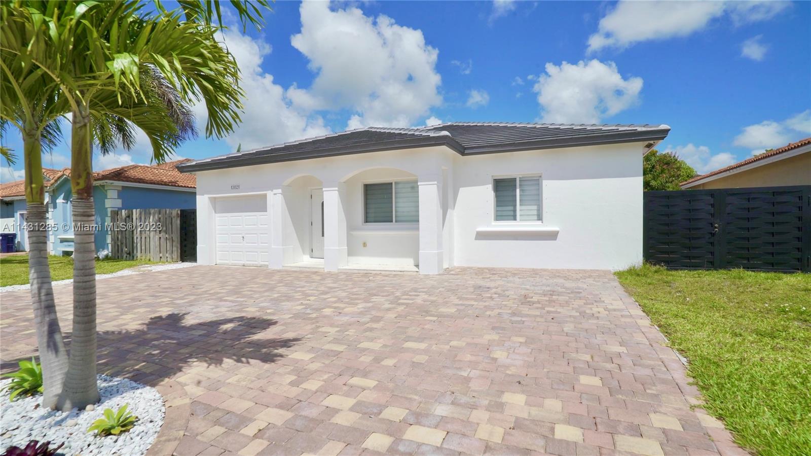 Beautiful, remodeled home, near the Homestead Air Reserve Base and Exit 5 of the Turnpike. This home features
an upgraded kitchen with granite and stainless steel appliances, tile and laminated wood floors, laundry room,
energy efficient light fixtures, upgraded patio, and plenty of space for parking and entertainment. THE RENT INCLUDES WATER, ELECTRICITY, AND INTERNET.  There is access to park a boat or RV.  The garage was converted into an efficiency, and it is NOT included in the rent. The owner rents that unit separately. There is no HOA, so there is a rather quick approval. Small dogs are ok with a $300 non refundable fee per pet. Tenant to pay a screening fee of $50 per adult. Listing office holds escrow once the Contract to Lease is accepted.
