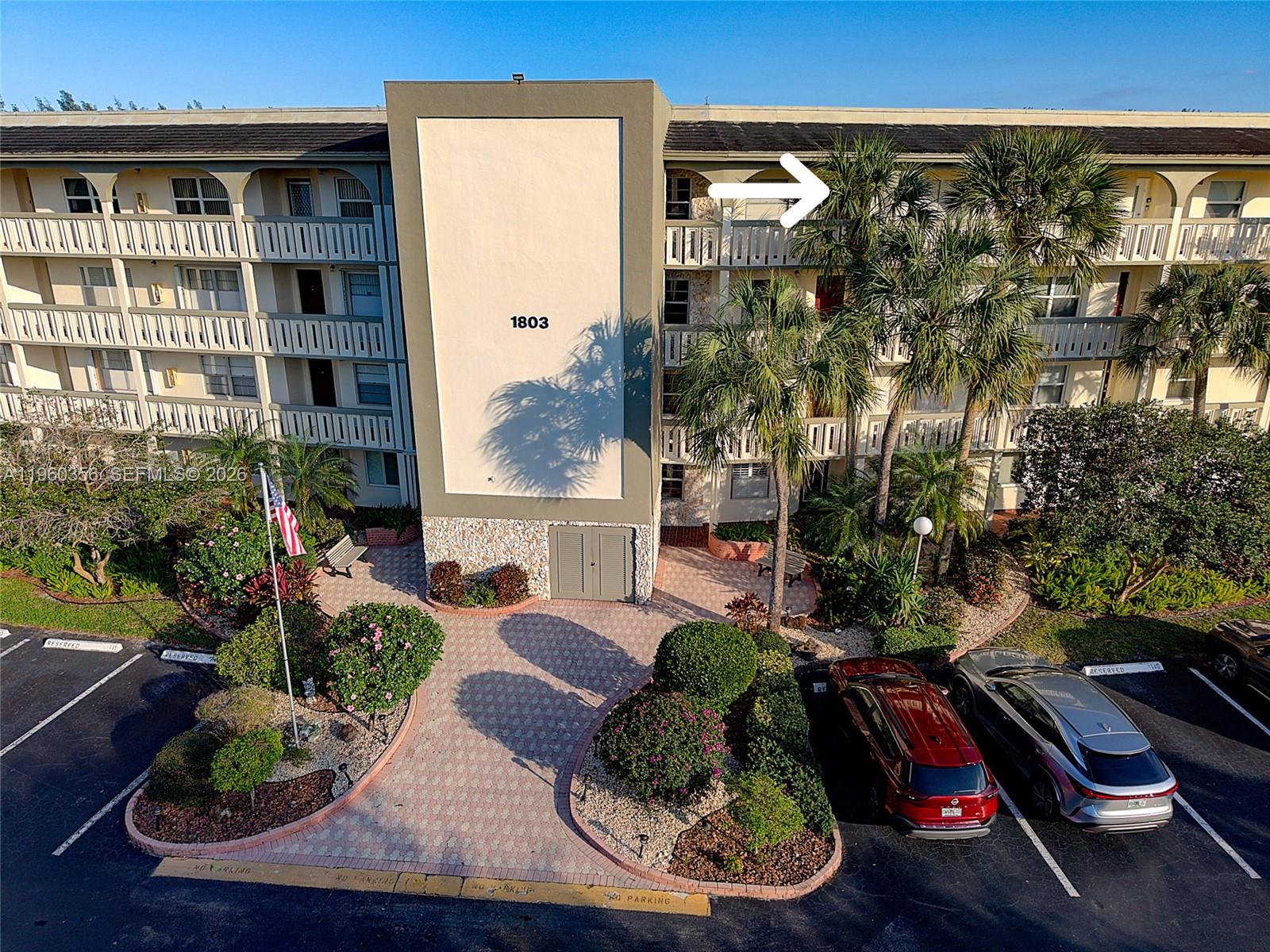 Step into comfort, light, and peace of mind in this impeccably kept 2-bed, 2-bath condo located in one of the community’s newer bldg. From the moment you enter, serene lake views set the tone for relaxed Florida living. The recessed foyer creates a sense of privacy, while the new impact-rated front door with frosted glass fills the space with soft natural light. A Ring doorbell adds modern convenience and security. This popular Juniper model offers a flow-through East-to-West layout, ensuring sunlight throughout the day. The enclosed patio features floor-to-ceiling impact windows with quiet views of the lake, fountain, and pool—an inviting space to enjoy your morning coffee or unwind at sunset. The breakfast area is currently used as a home office, and the kitchen opens to a warm dining and living area designed for easy entertaining. Guests can access the patio directly from the living space w/o entering the primary suite, adding both functionality and privacy. Recent bldg improvements include a new elevator, roof, smoke and fire detectors, pool furniture, and new catwalk painting. Residents enjoy a vibrant, amenity-rich lifestyle with a golf course, clubhouse, fitness center, theater, pools, sports courts, courtesy transportation, organized activities, and beautifully landscaped grounds. Conveniently located near highways, shopping, dining, and just a short drive to the beach, this home is ideal whether you’re downsizing or searching for the perfect Florida getaway. A/C 2024