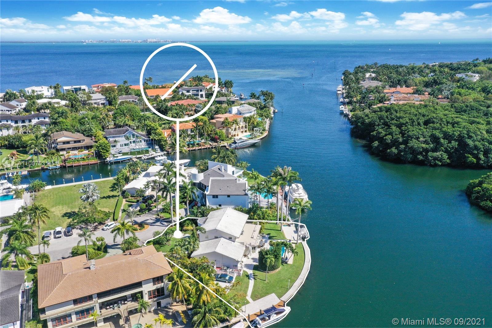 (--Sunrise to Sunset--) Dynamic waterfront point lot/cul-de-sac property with 180 ft frontage and deep water! Enjoy phenomenal sunrises over the bay to the east and the sunset up the channel to the west--all while being mesmerized by the watercrafts as they cruise on by. The 2-story Colonial features several sitting areas, elevator and impact windows/doors. It enjoys a downstairs bedroom with en-suite + powder room while the main bedroom is upstairs along with 2 bedrooms + hall bath. The home will merit updating or perhaps tear down and start anew. Items of note are a newer concrete seawall, 2 docks and the obvious NO BRIDGES to bay. Guard-gated Sunrise Harbour, with less than 100 homes, is in Coral Gables yet bordering Coconut Grove with its nearby village center only a bike ride away.