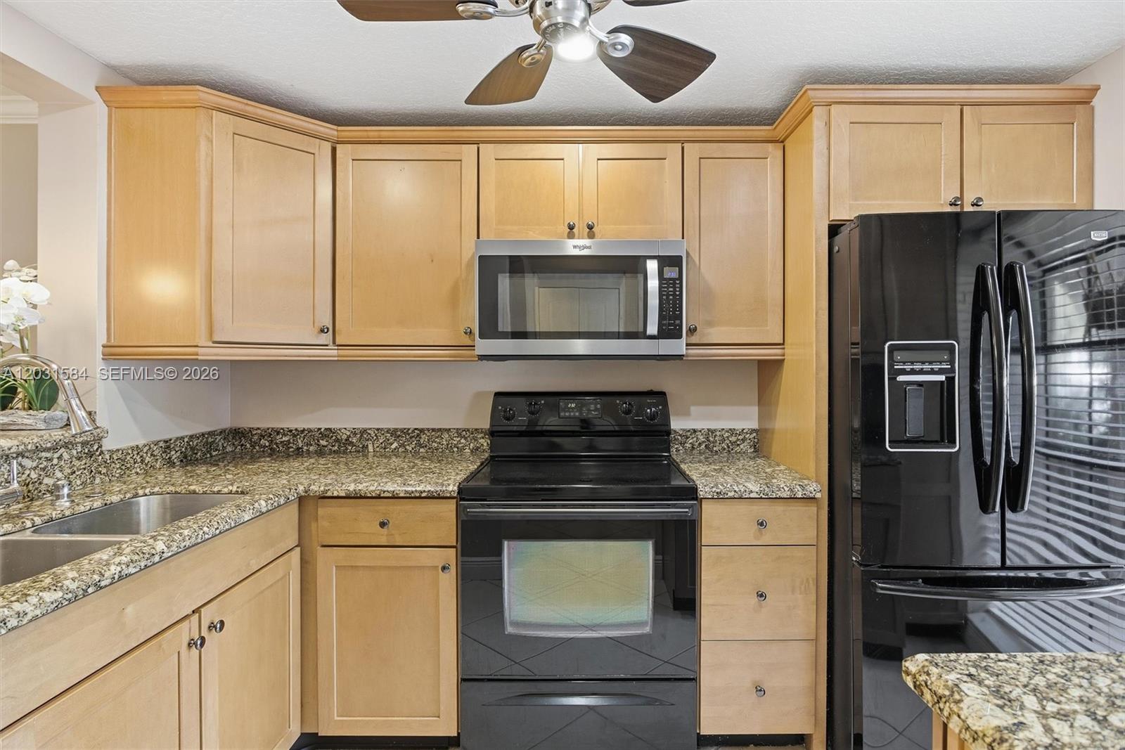SELLER FINANCING AVAILABLE. Welcome to this inviting 2-bed, 2-bath first-floor condo located in a peaceful, tree-lined Deerfield Beach community. This home offers a comfortable layout with tile flooring throughout, a kitchen featuring warm wood cabinetry and granite countertops, and updated bathrooms with matching granite finishes.

The spacious primary bedroom includes a private en-suite bathroom and generous closet space. Enjoy the Florida lifestyle from your screened-in porch overlooking a quiet garden view, perfect for morning coffee or unwinding after a long day.

Located just minutes from shopping, dining, major highways, and the beautiful Deerfield Beach coastline. Amenities include pool, jacuzzi, clubhouse, and a gym.  Located within walking distance you will find a park with a walking trail, children's play area and tennis courts. This condo offers convenience in an all-age community feel.