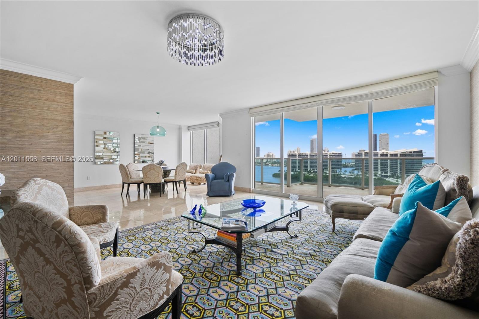 This spacious 2-bed, 2.5-bath residence, with 2,980 sq. ft. of interior space, offers a flow-through floor plan. Enjoy stunning sunrises and panoramic ocean and bay views from the large balconies. The main suite features a balcony, a walk-in closet, an oversized suite bathroom, a media room, a laundry room, and plenty of storage space. The Peninsula is a full-service building with 24-hour security, a grand lobby, and extensive recreational areas. Amenities include two swimming pools with towel service, two gyms, three tennis courts, a game room, and a dedicated dog walking area with a private dog park. Located near Aventura Mall and top-rated schools, surrounded by shopping, dining, and entertainment options, it is the perfect blend of luxury and convenience.