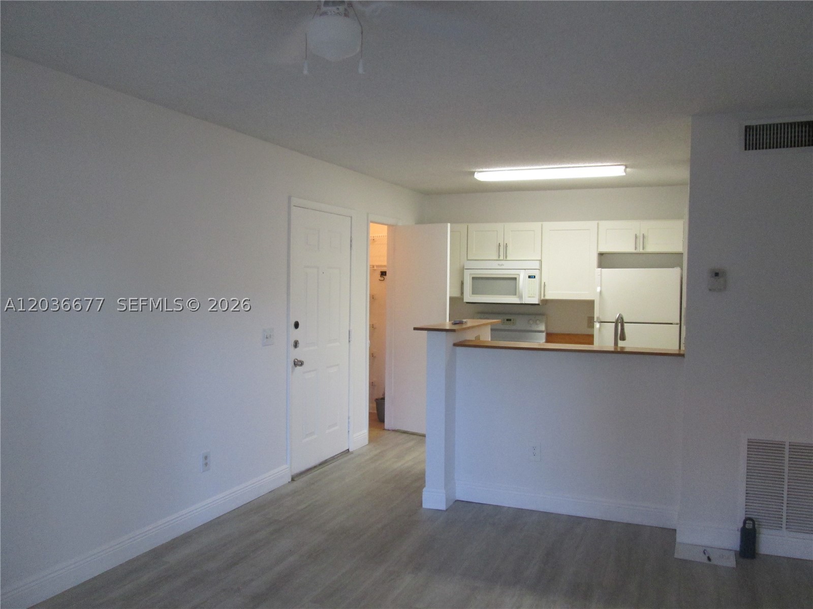 Updated, 1st floor 1/1 with screened balcony that has a small storage closet and close to pool and tennis courts.  Stackable WASHER/DRYER IN UNIT, large pantry and laminate flooring throughout.  Bedroom is nice sized with a huge walk-in closet with enough room for a small workspace.  Gated community with 2 pools, tennis courts, gym, clubhouse, jogging trail and security patrol.  Easy to show on short notice and easy access to restaurants and shopping.  Please contact list agent for any questions, anytime!
