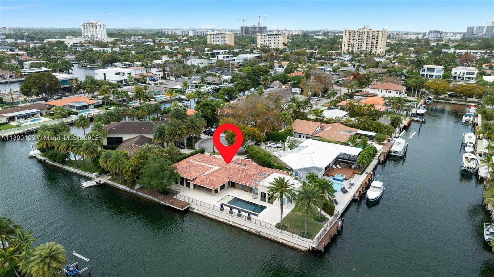 This stunning 4-bedroom, 5-bathroom home is a true waterfront oasis, offering 180 feet of prime water frontage on a spacious corner lot. Perfect for boating enthusiasts, the property features two private boat docks, providing direct access to the water. The home boasts expansive living spaces, with large windows that offer breathtaking views of the serene surroundings. Enjoy outdoor living with a sparkling pool, ideal for relaxation and entertaining. With luxurious finishes and ample space, this property is the perfect blend of comfort and elegance.